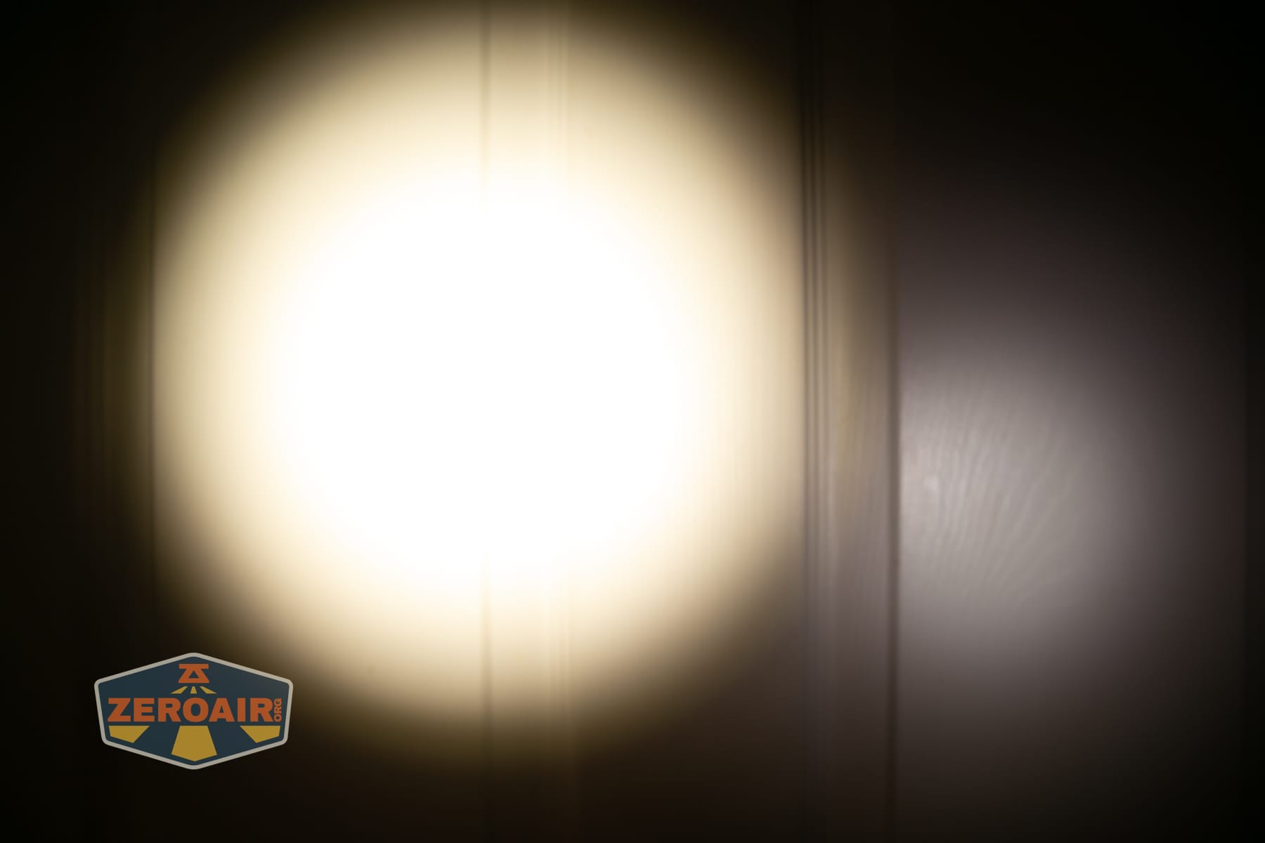 Niwalker ES01 Three Light flashlight beamshots on door (at 1') compared to nichia 219b 4500K