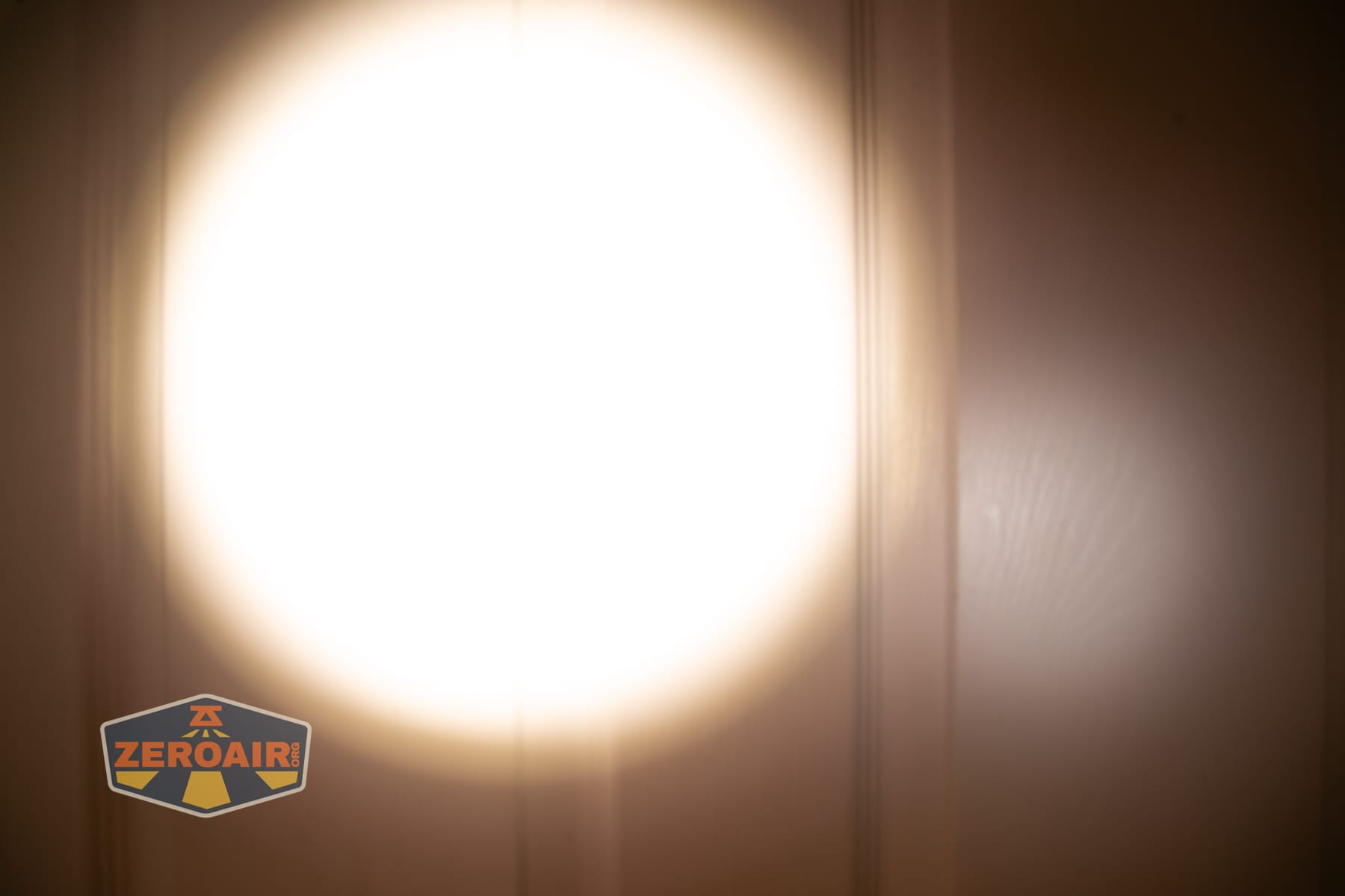 Niwalker ES01 Three Light flashlight beamshots on door (at 1') compared to nichia 219b 4500K