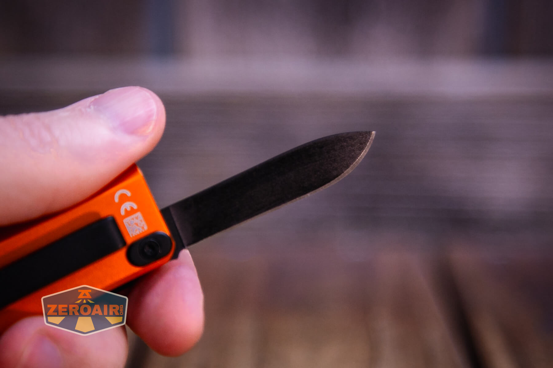 Olight Oknife MK knife open in hand