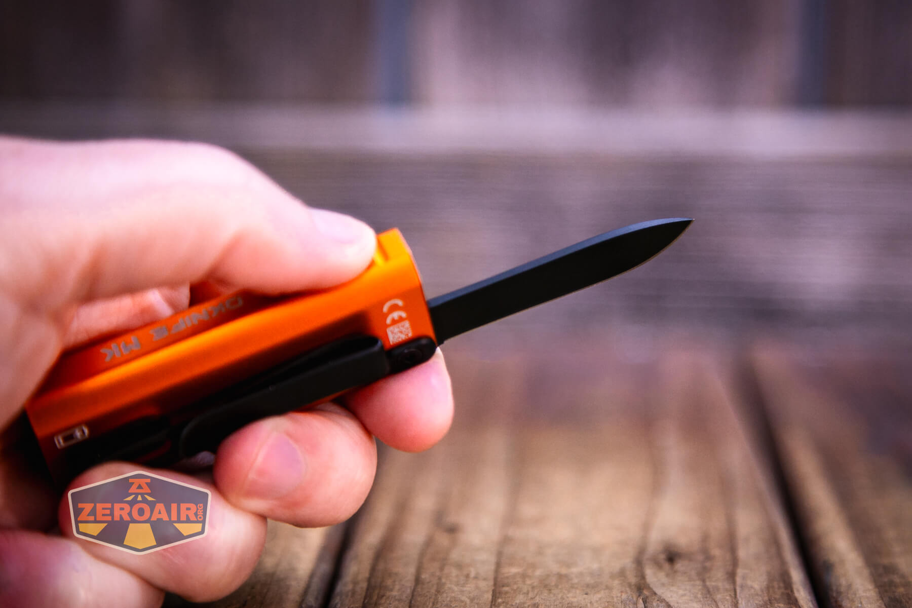 Olight Oknife MK knife open in hand