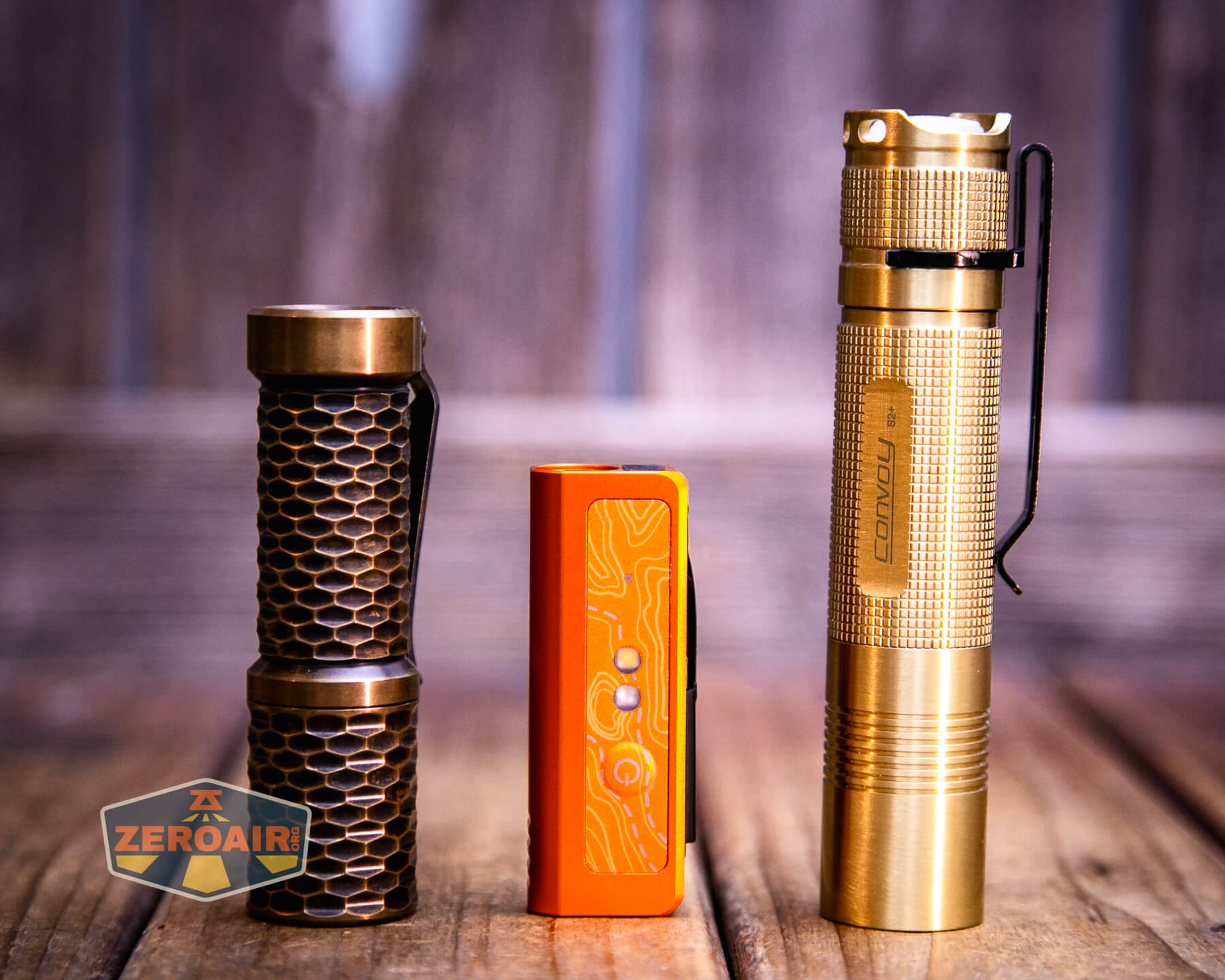 Olight Oknife MK with two standard sized flashlights