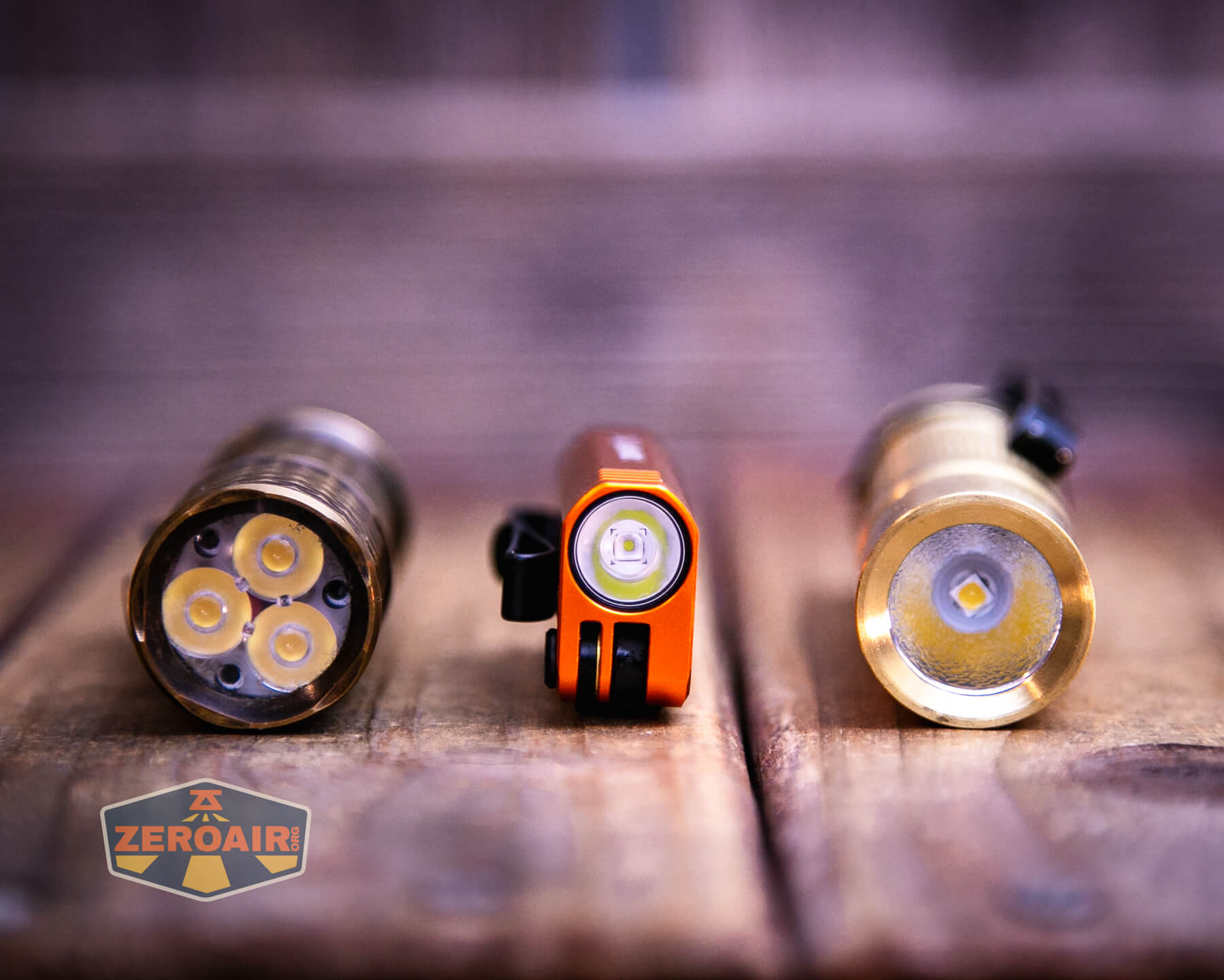 Olight Oknife MK with two standard sized flashlights