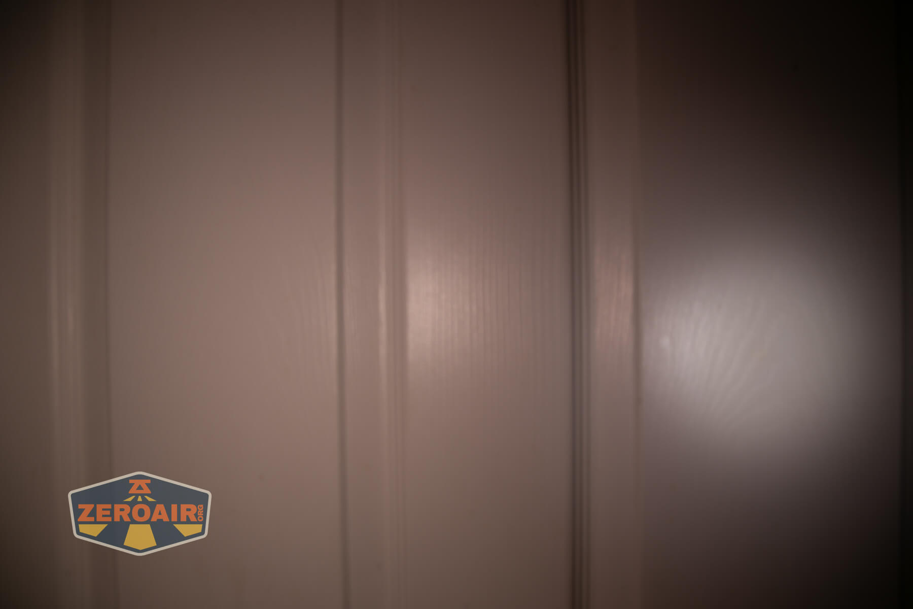 Olight Oknife MK beamshots on door (at 1') compared to nichia 219b 4500K