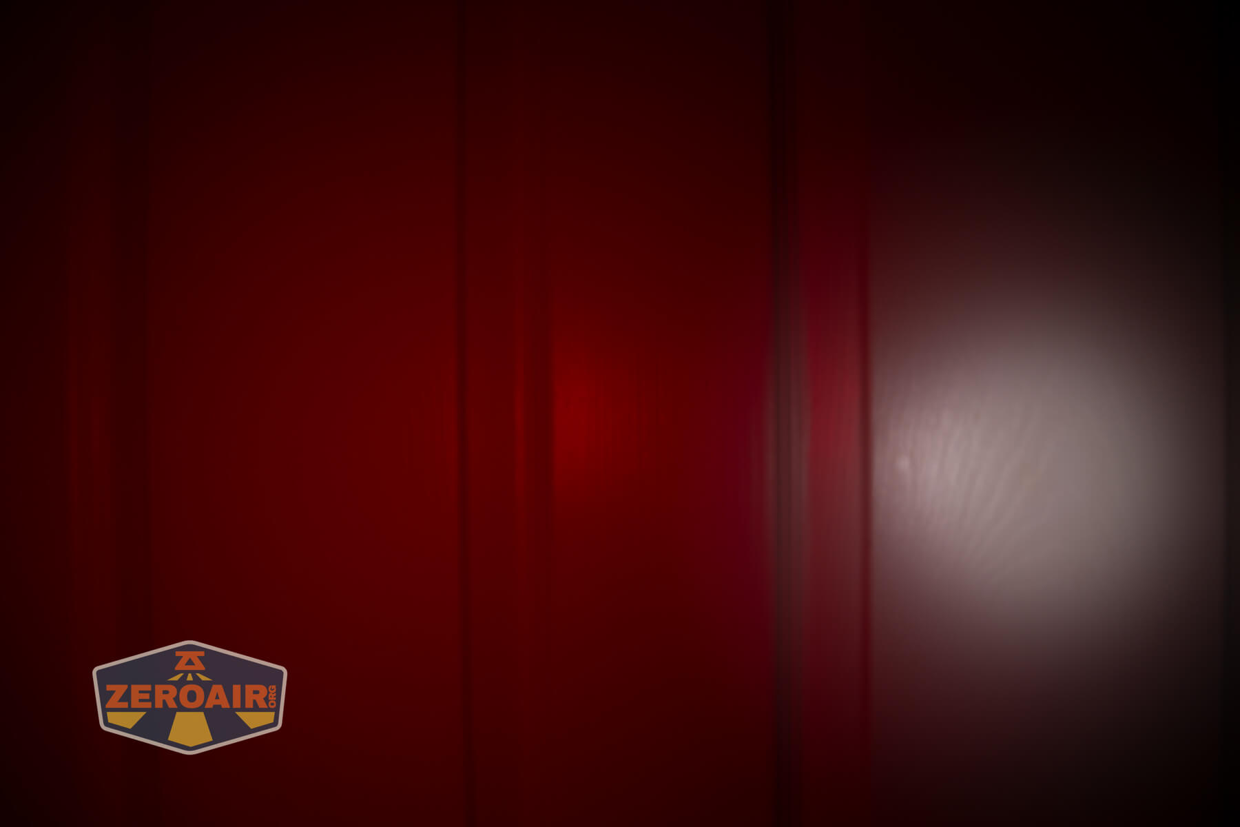 Olight Oknife MK beamshots on door (at 1') compared to nichia 219b 4500K
