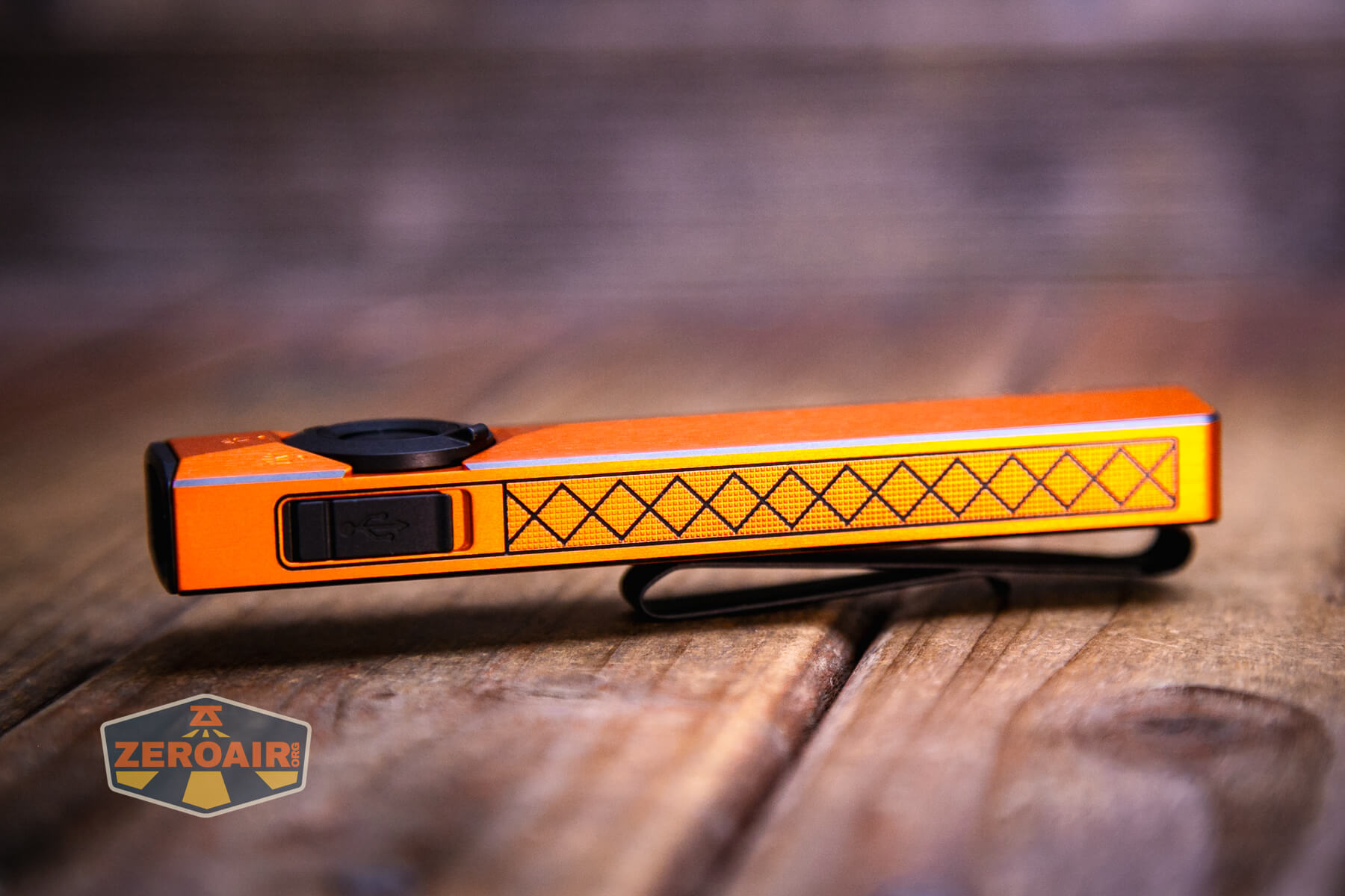 Olight ArkPro Ultra Orange flat EDC flashlight side design