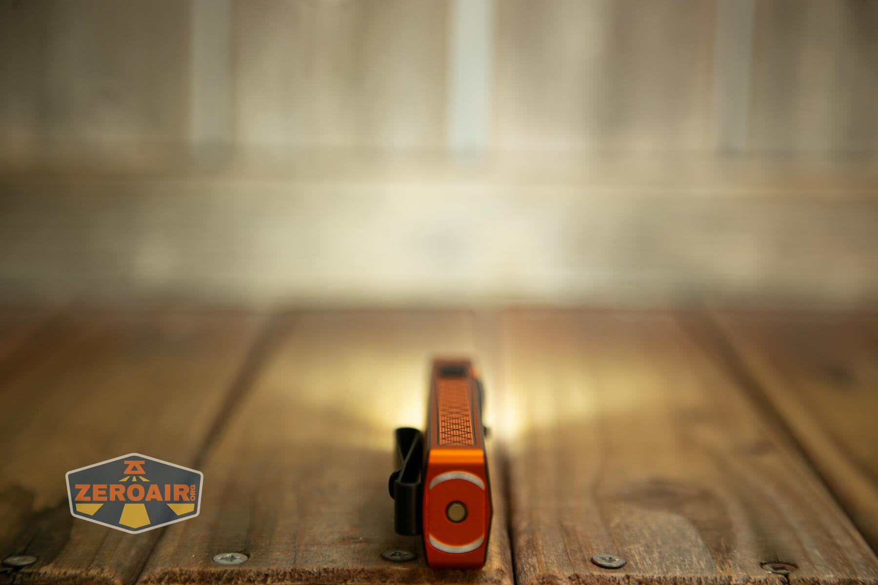 Olight ArkPro Ultra Orange flat EDC flashlight front white emitter on