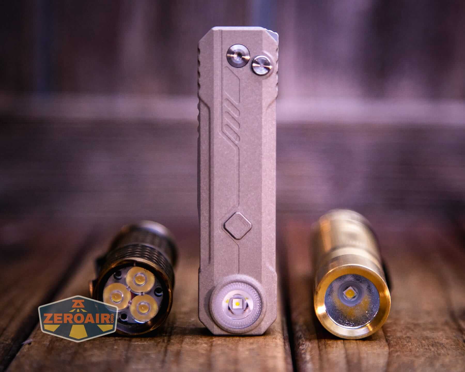 Olight Oknife LK folding knife flashlight with two standard sized flashlights