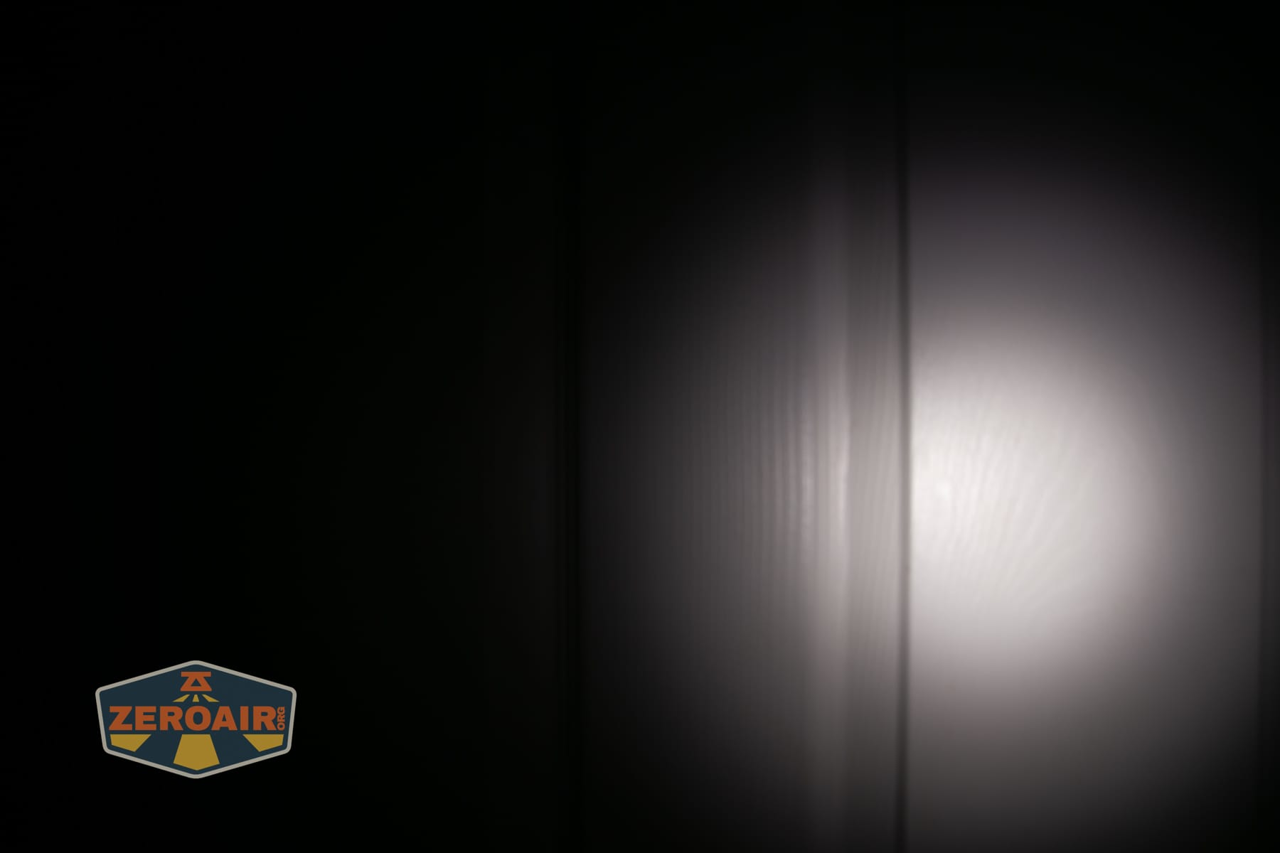 Skilhunt H150V4 5000K headlamp beamshots on door (at 1') compared to nichia 219b 4500K