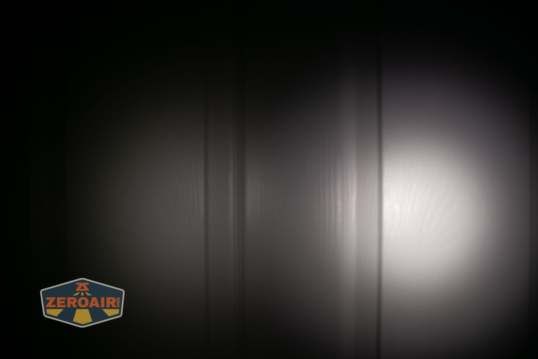 Skilhunt H150V4 5000K headlamp beamshots on door (at 1') compared to nichia 219b 4500K