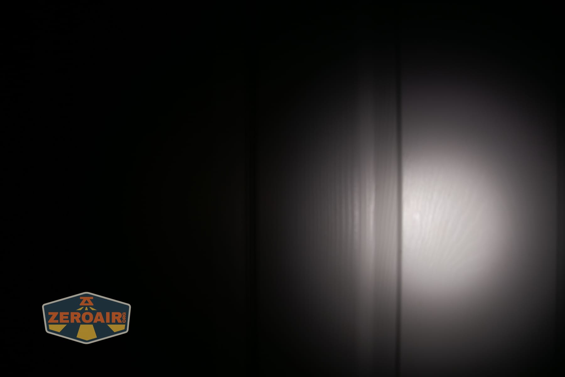 Skilhunt H150V4 3000K headlamp beamshots on door (at 1') compared to nichia 219b 4500K