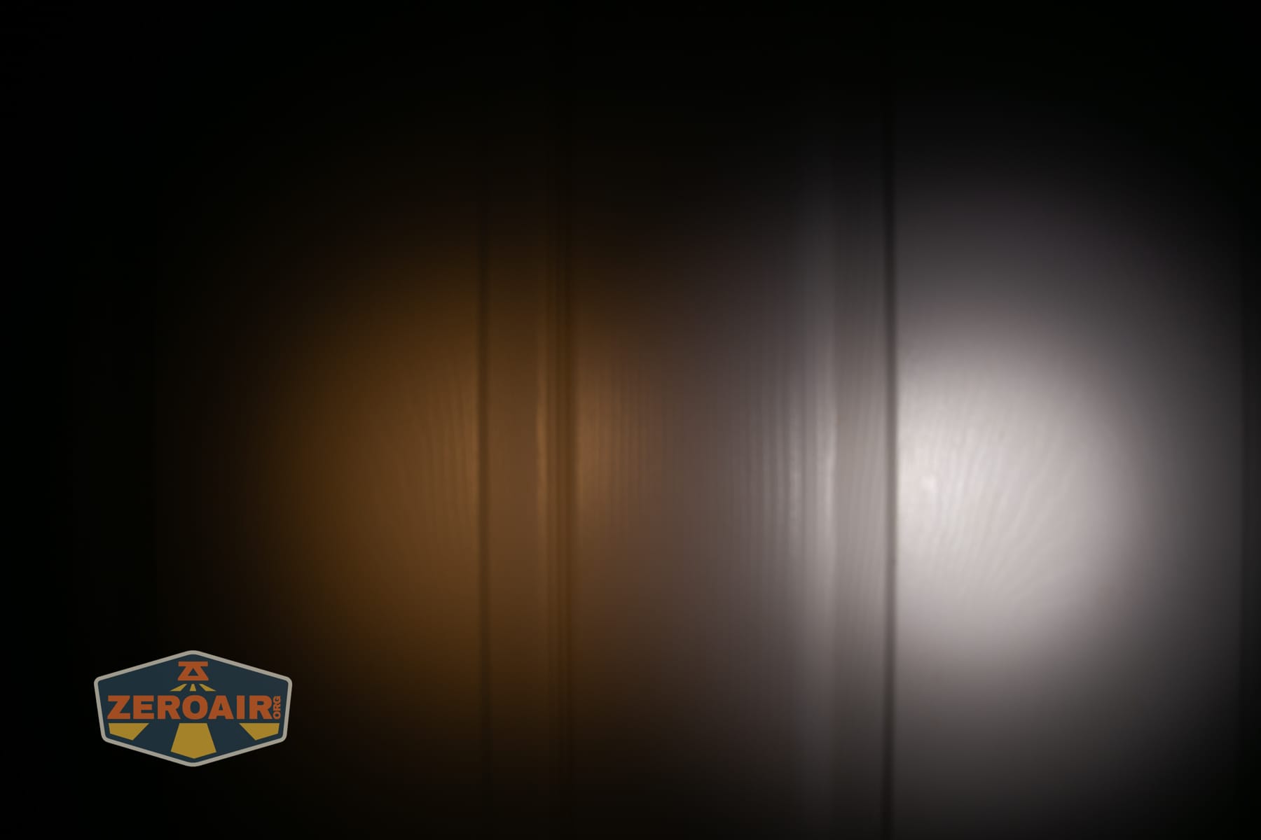 Skilhunt H150V4 3000K headlamp beamshots on door (at 1') compared to nichia 219b 4500K