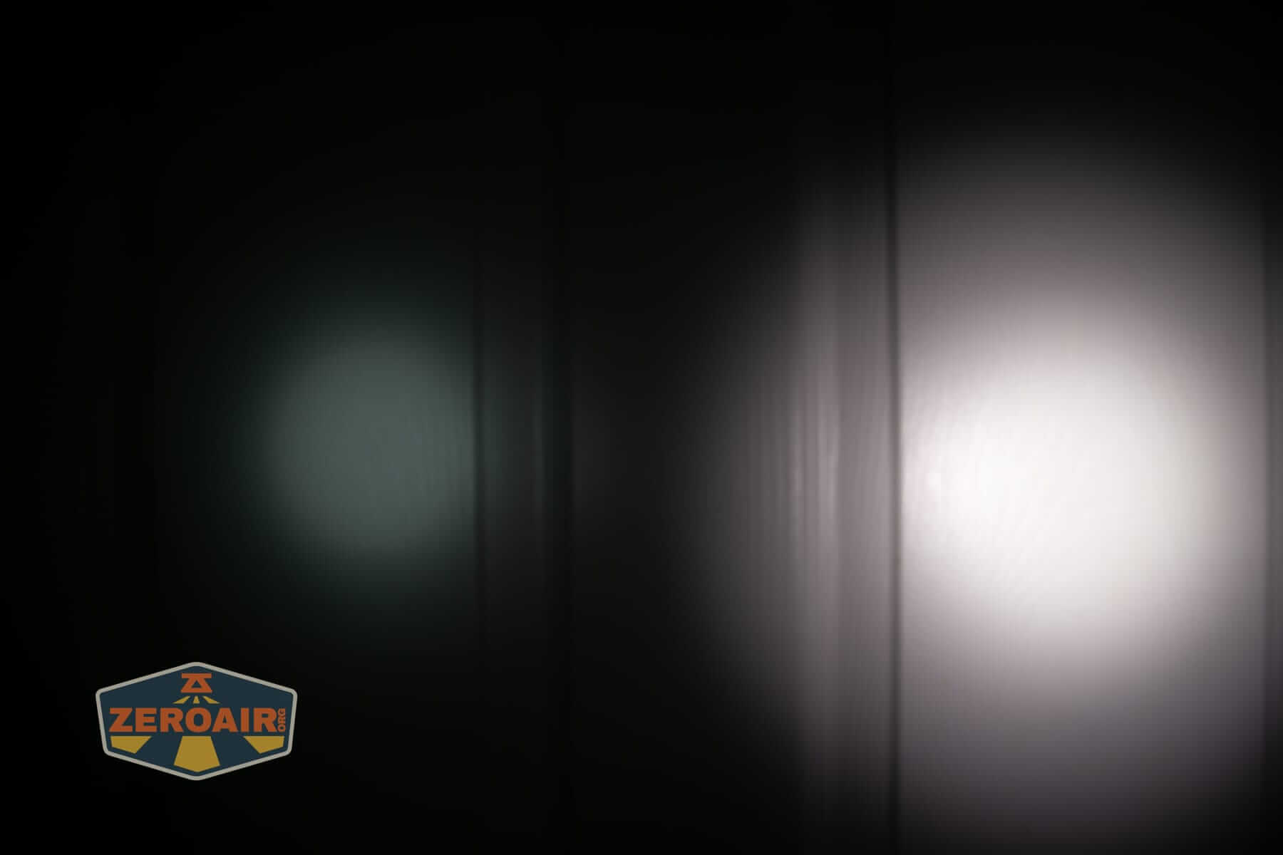 Sofirn SK31 Tactical Duty flashlight beamshots on door (at 1') compared to nichia 219b 4500K