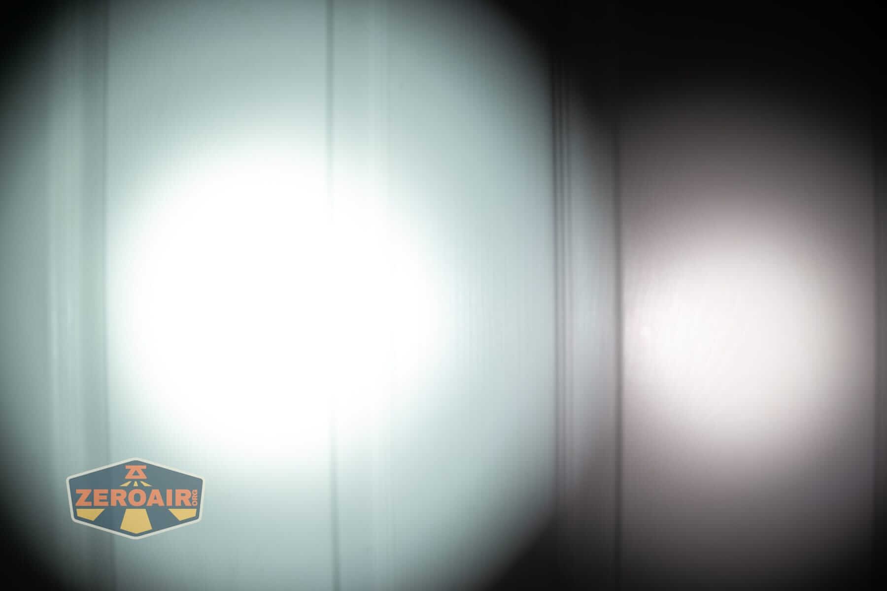 Sofirn SK31 Tactical Duty flashlight beamshots on door (at 1') compared to nichia 219b 4500K