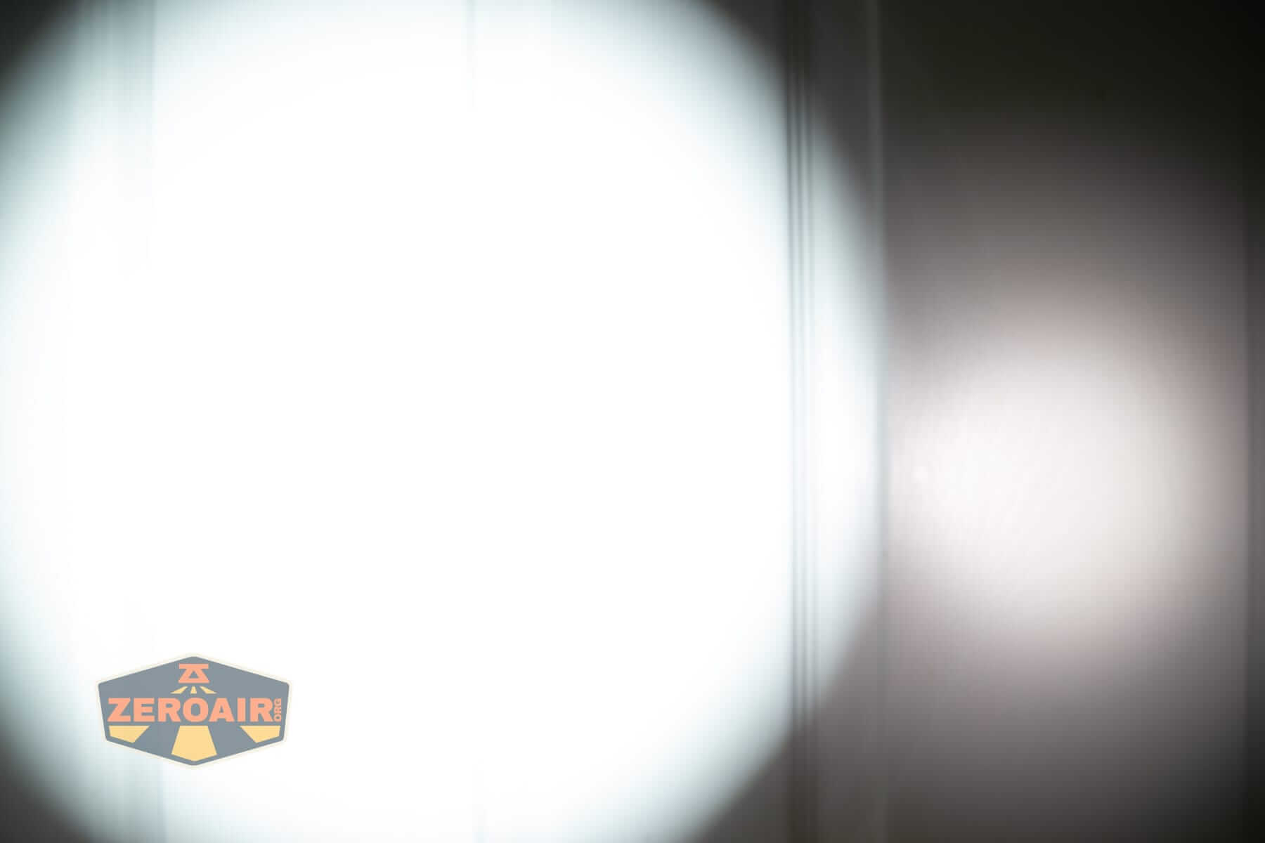 Sofirn SK31 Tactical Duty flashlight beamshots on door (at 1') compared to nichia 219b 4500K