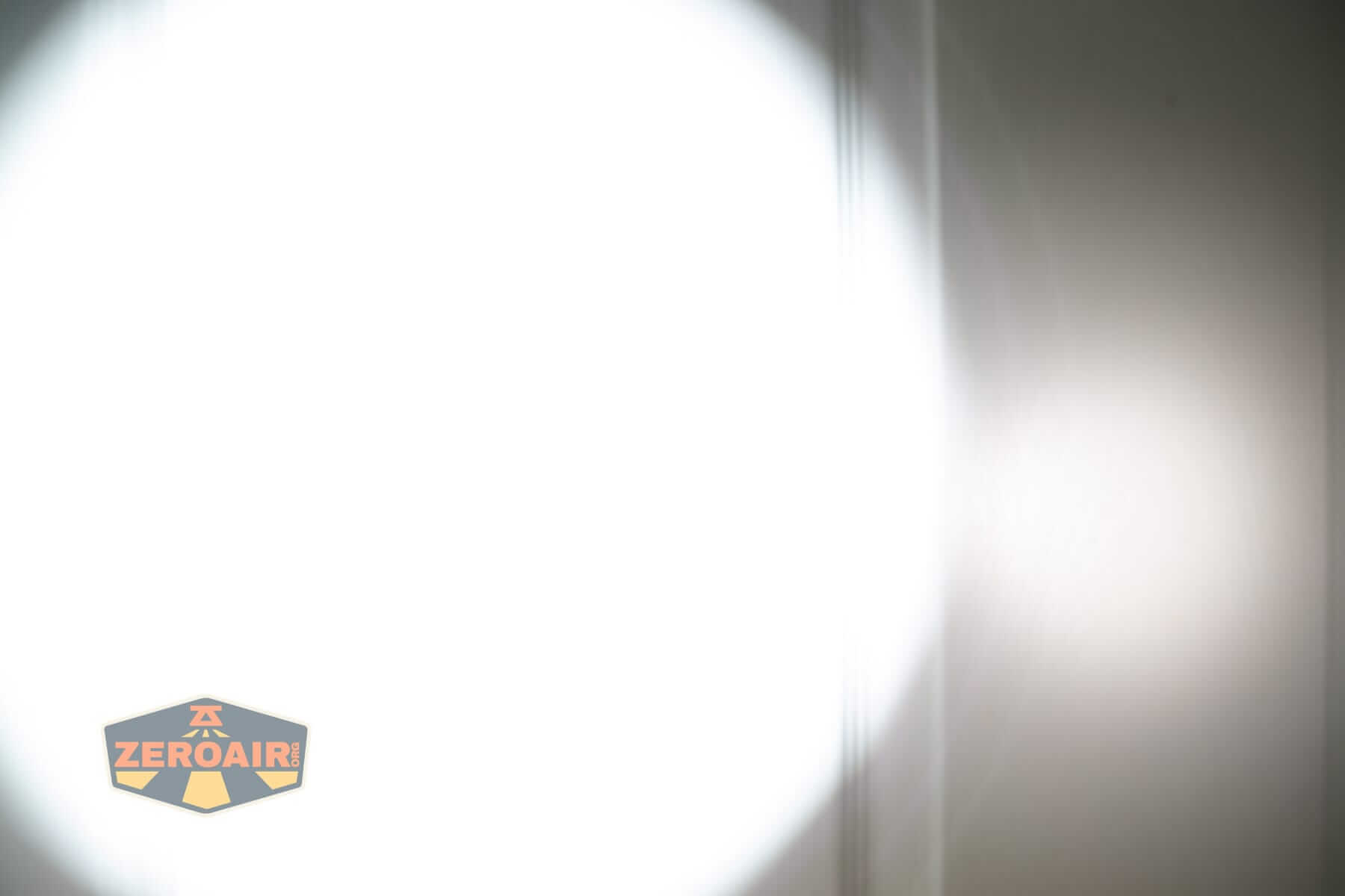 Sofirn SK31 Tactical Duty flashlight beamshots on door (at 1') compared to nichia 219b 4500K