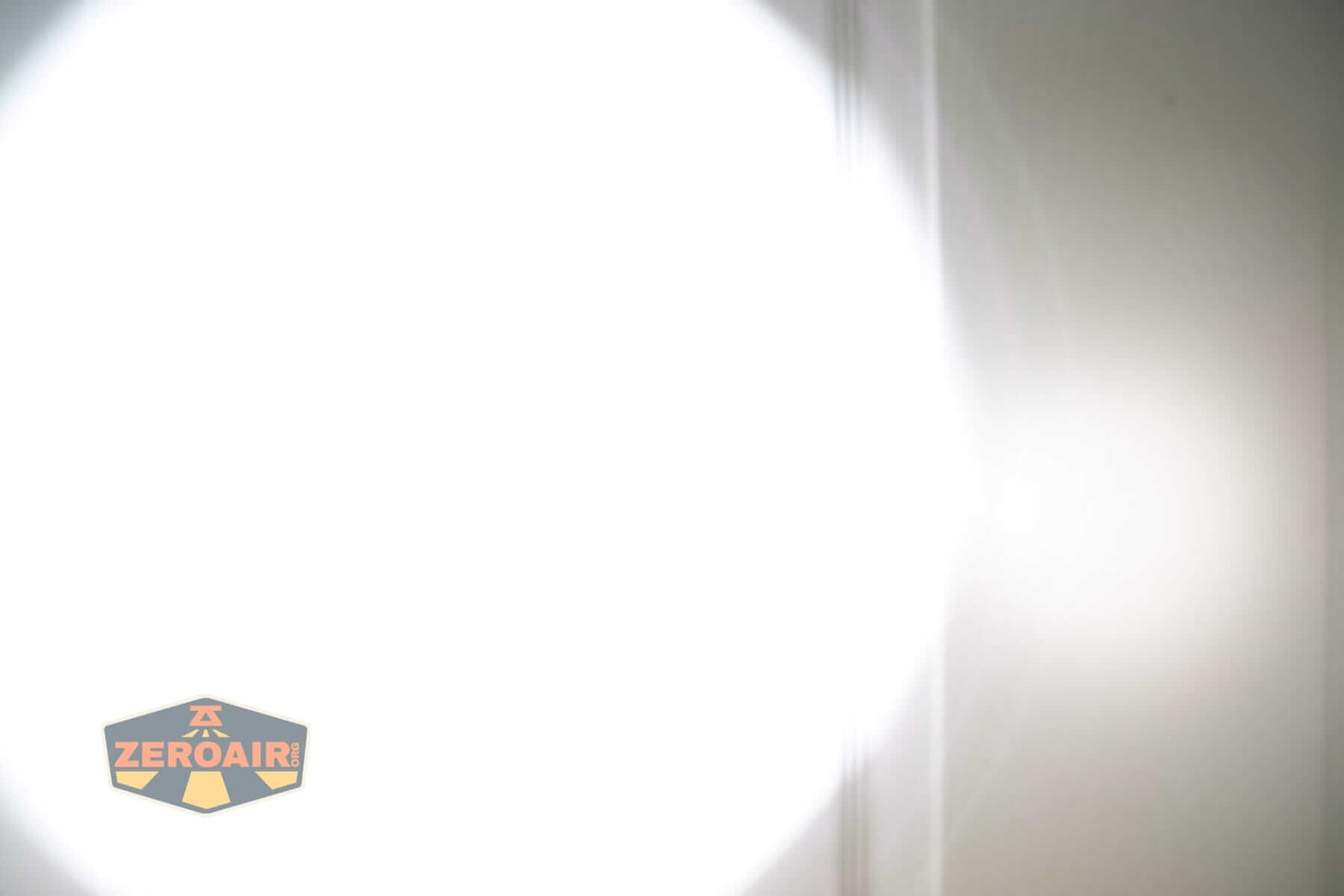 Sofirn SK31 Tactical Duty flashlight beamshots on door (at 1') compared to nichia 219b 4500K