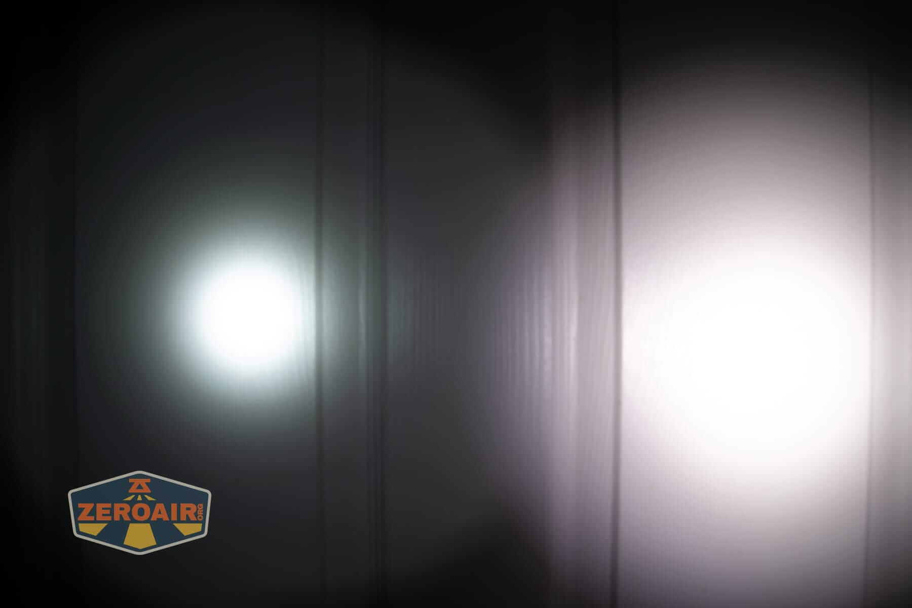 Speras EST UV flashlight beamshots on door (at 1') compared to nichia 219b 4500K