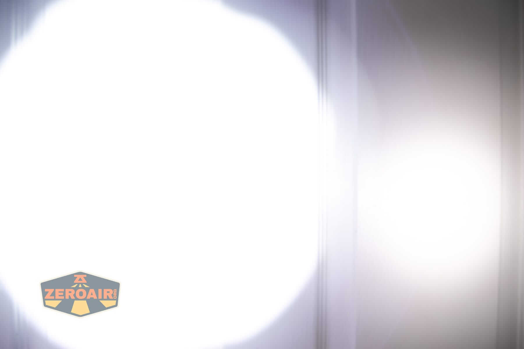 Speras EST UV flashlight beamshots on door (at 1') compared to nichia 219b 4500K