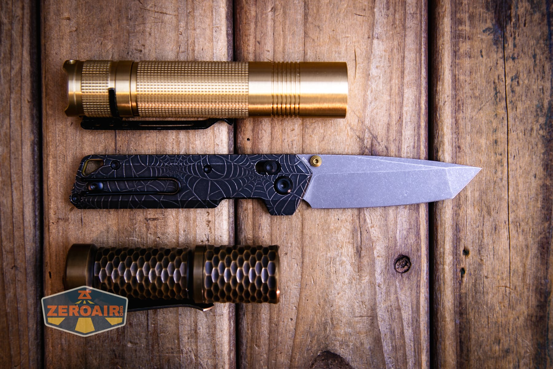 Vosteed Parallel Spiderweb knife with two standard sized flashlights