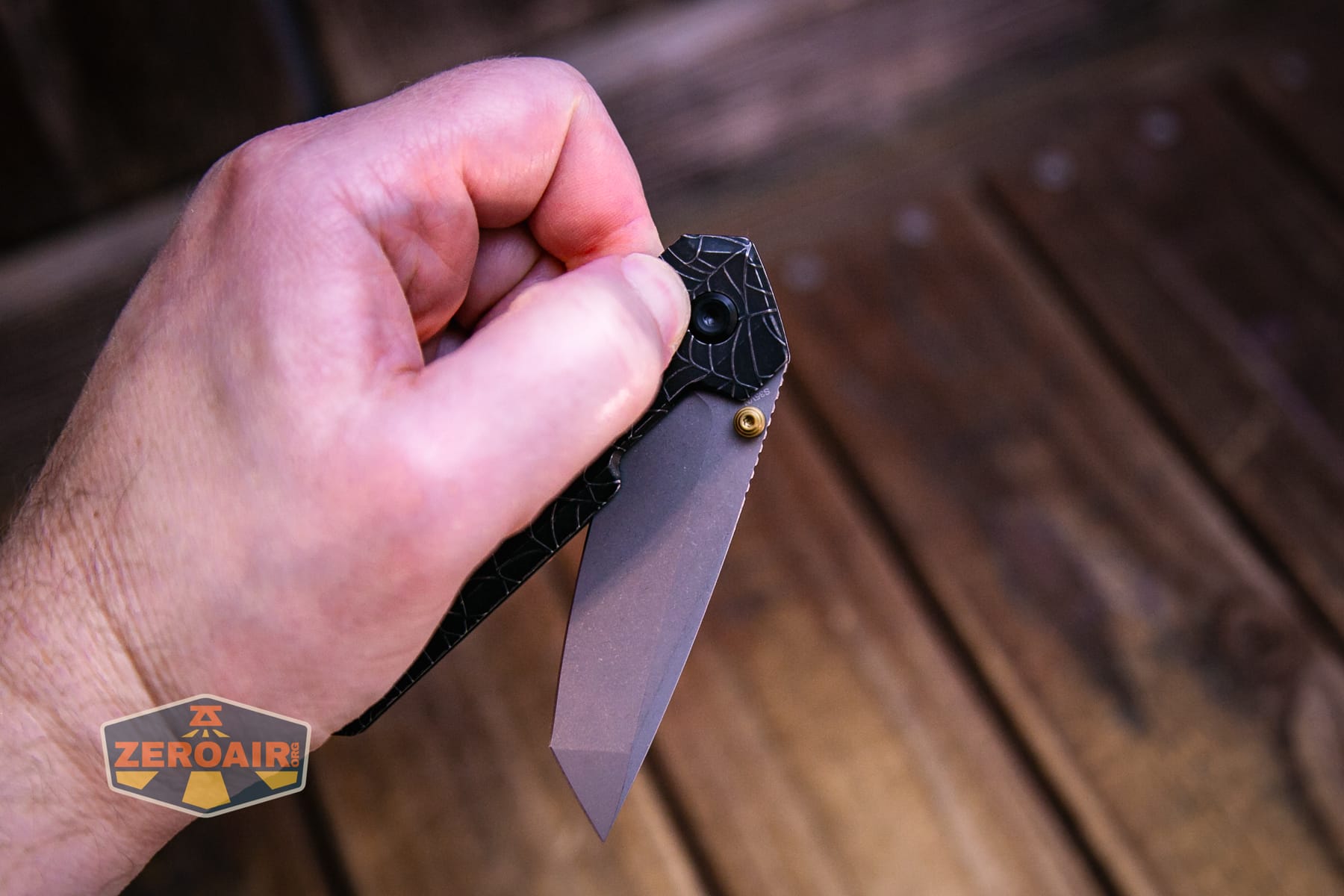 Vosteed Parallel Spiderweb knife in hand crossbar action