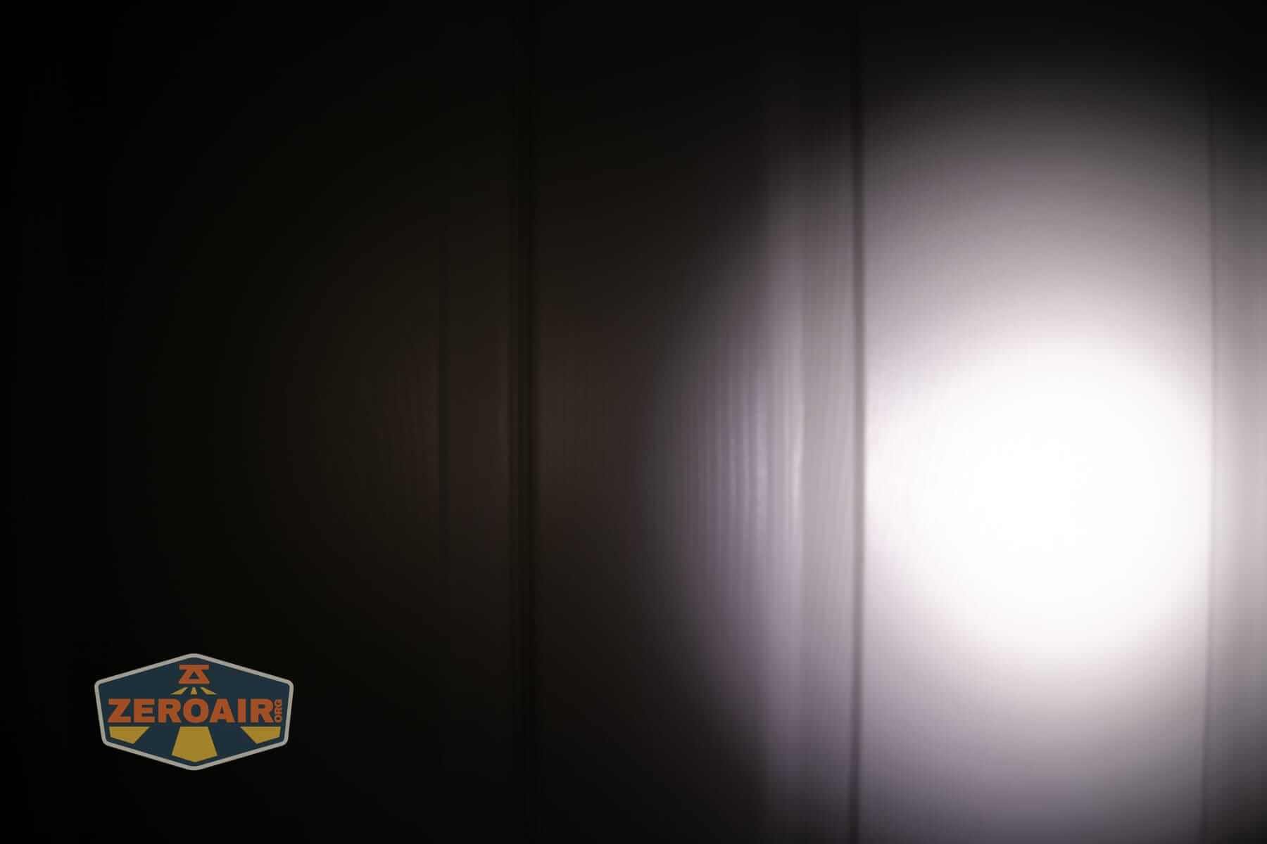 Wurkkos HD02 Mini EDC flashlight beamshots on door (at 1') compared to nichia 219b 4500K