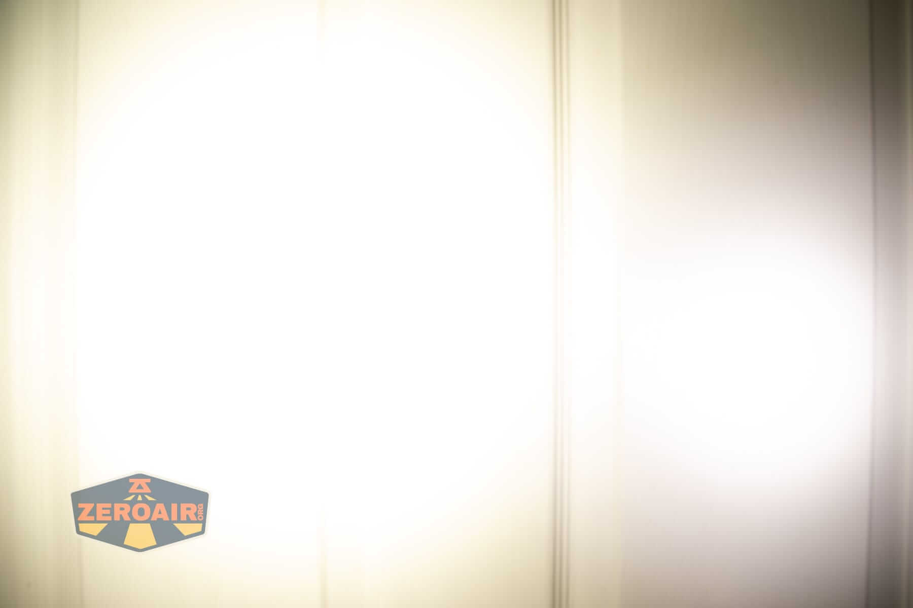 Wurkkos HD02 Mini EDC flashlight beamshots on door (at 1') compared to nichia 219b 4500K