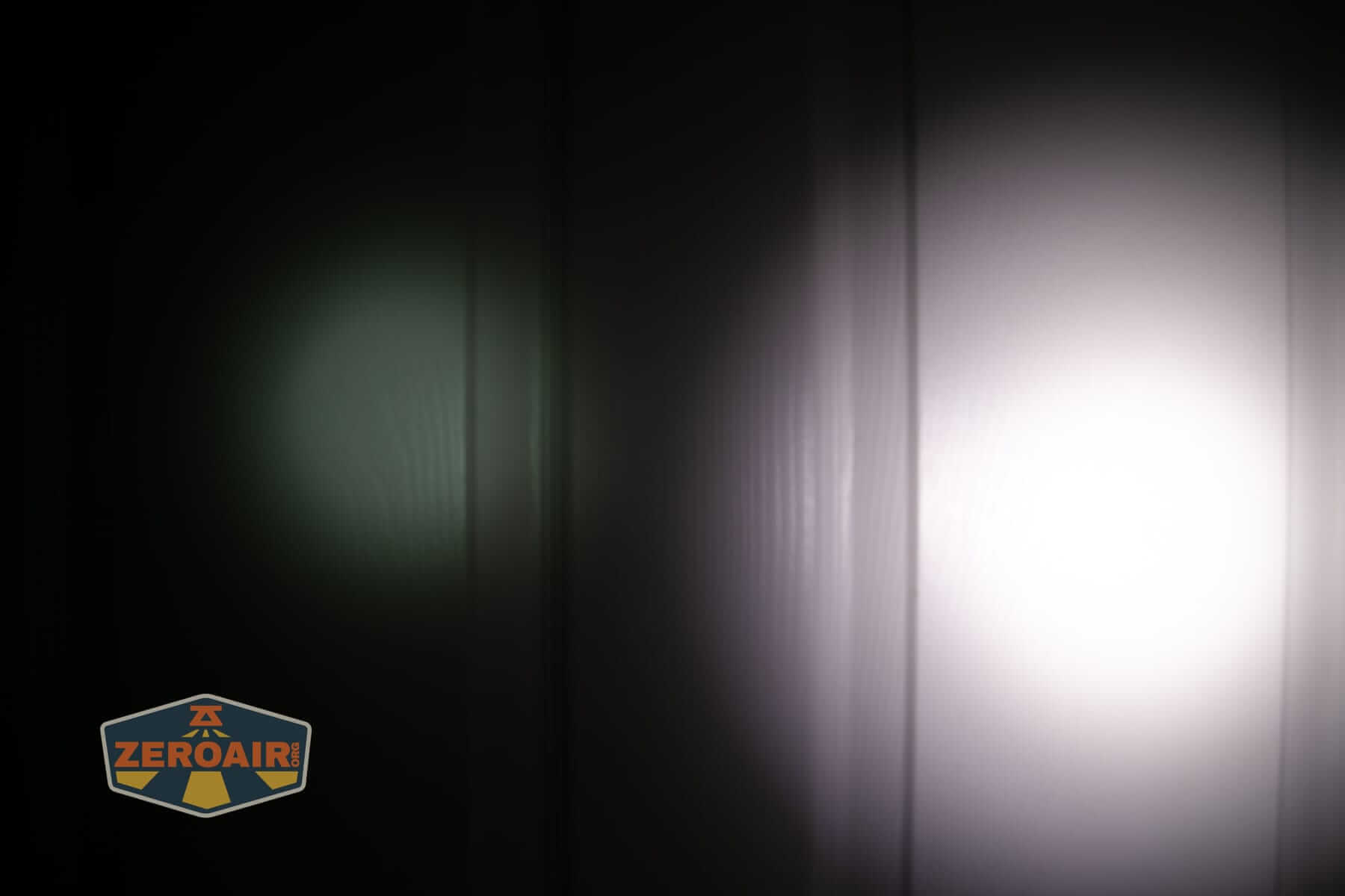 Wurkkos HD02 Mini EDC flashlight beamshots on door (at 1') compared to nichia 219b 4500K