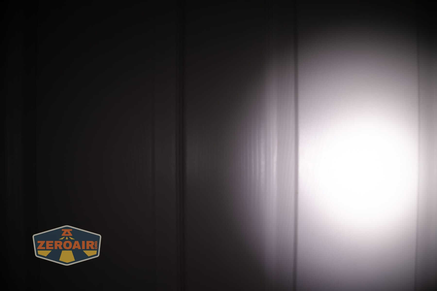 Wurkkos HD02 Mini EDC flashlight beamshots on door (at 1') compared to nichia 219b 4500K
