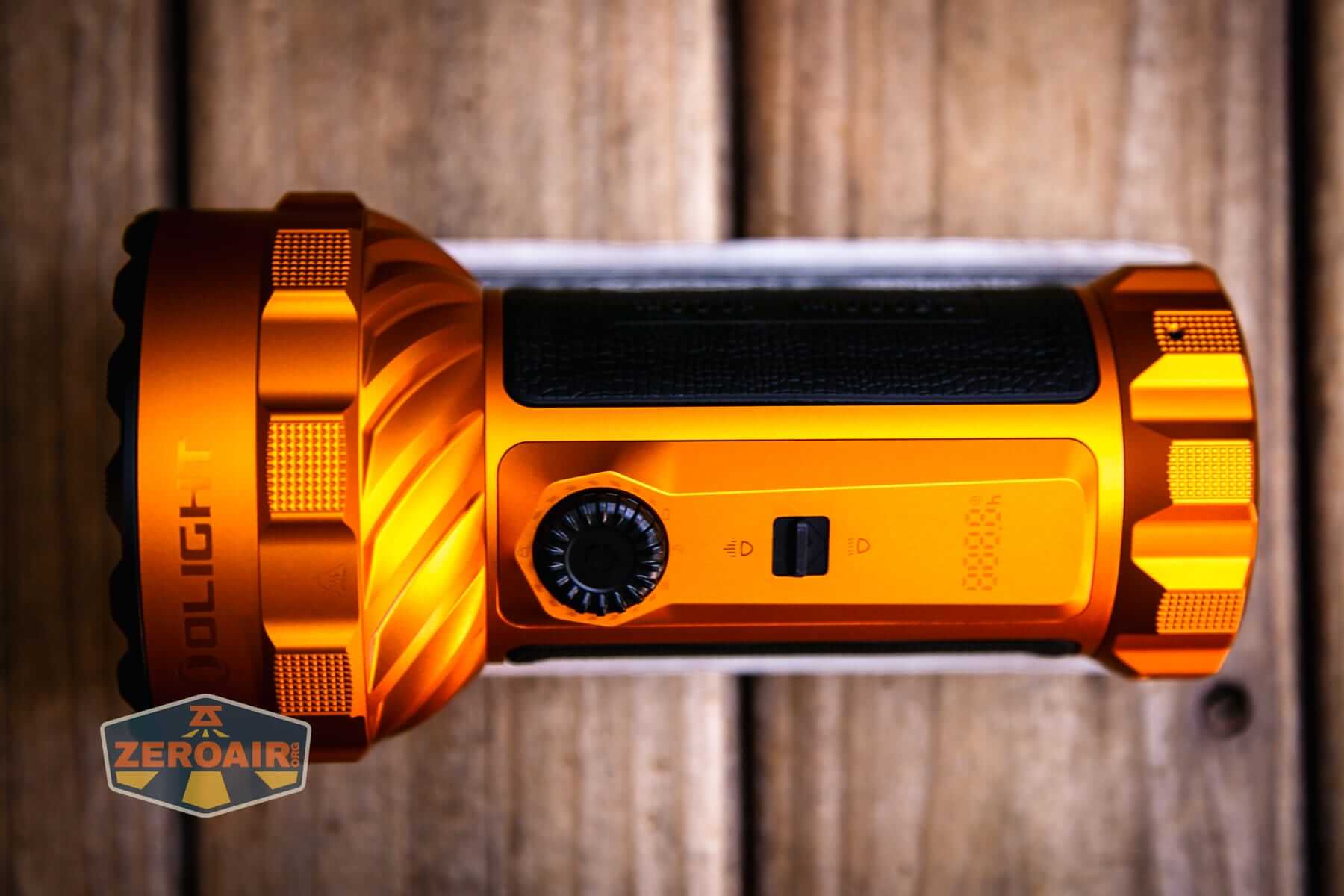 Olight Marauder 3 on two dollar bill