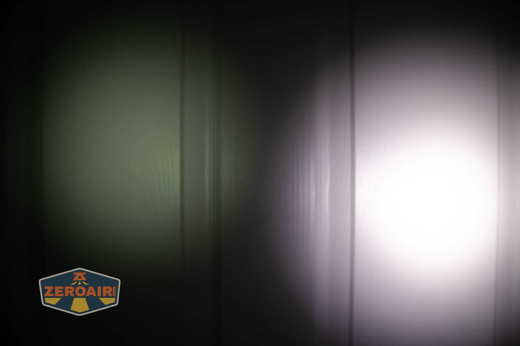 Olight Marauder 3 beamshots on door compared to nichia 219b