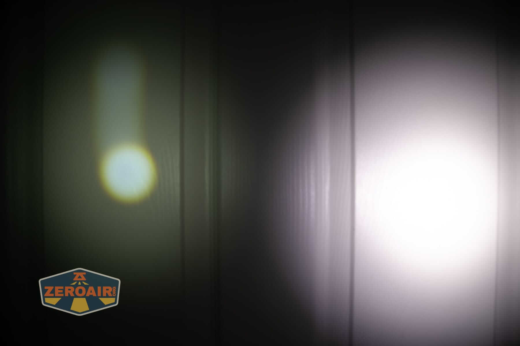 Olight Marauder 3 beamshots on door compared to nichia 219b