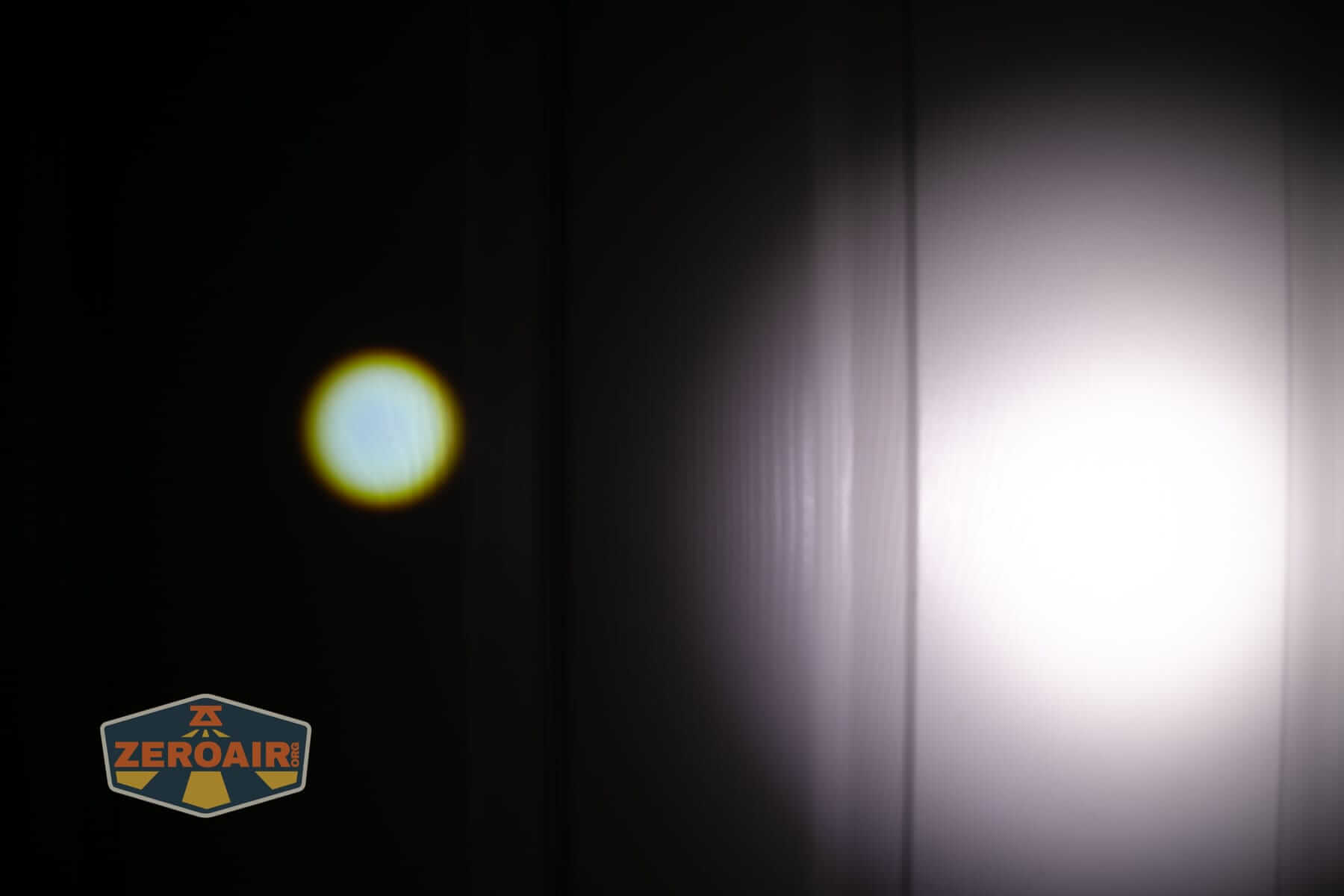 Olight Marauder 3 beamshots on door compared to nichia 219b