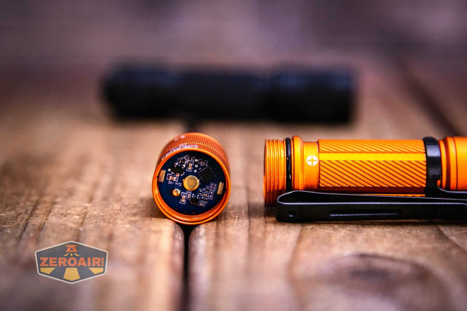 Skilhunt E2A V2 flashlight showing threads and button