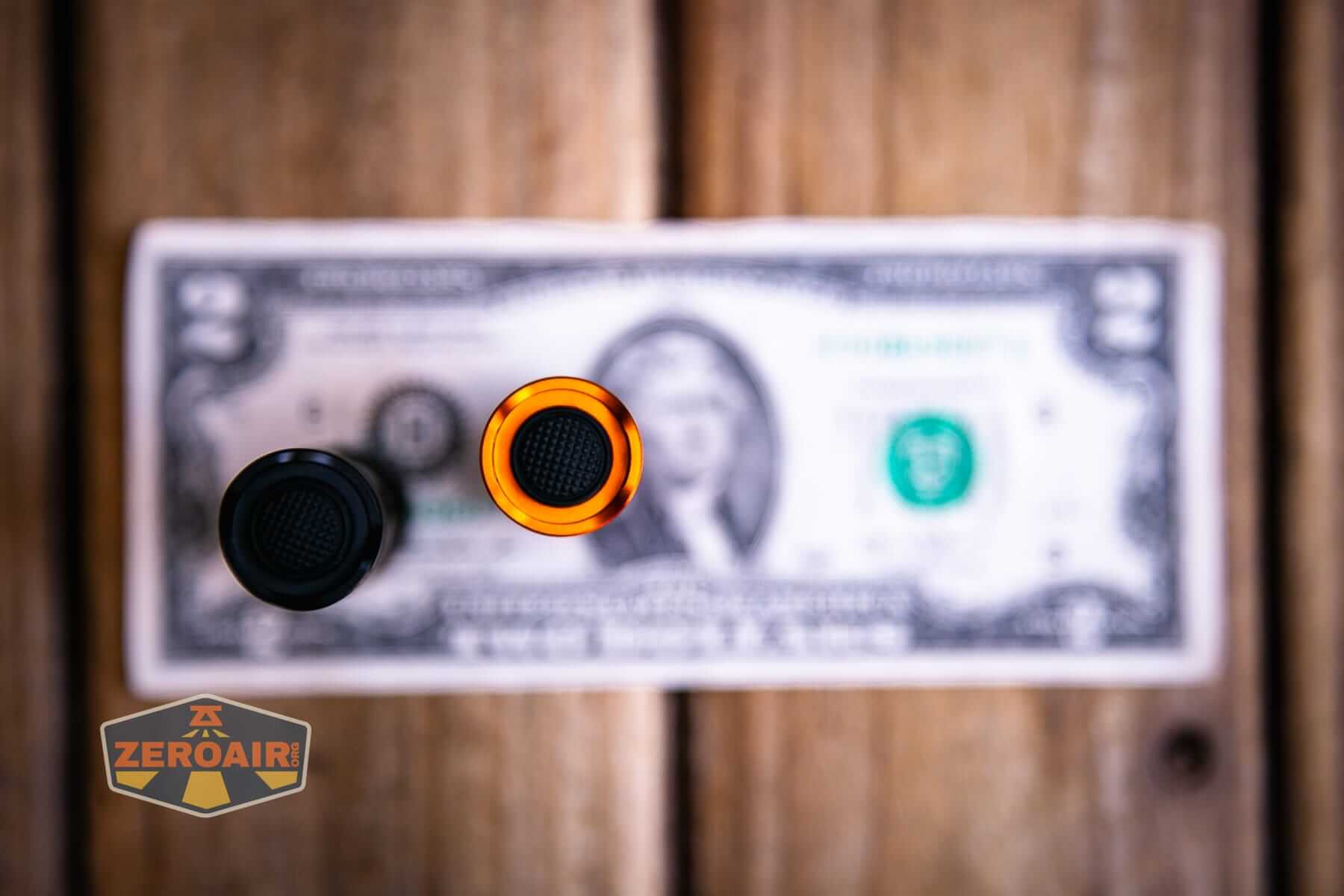 Skilhunt E2A V2 flashlight on a two dollar bill