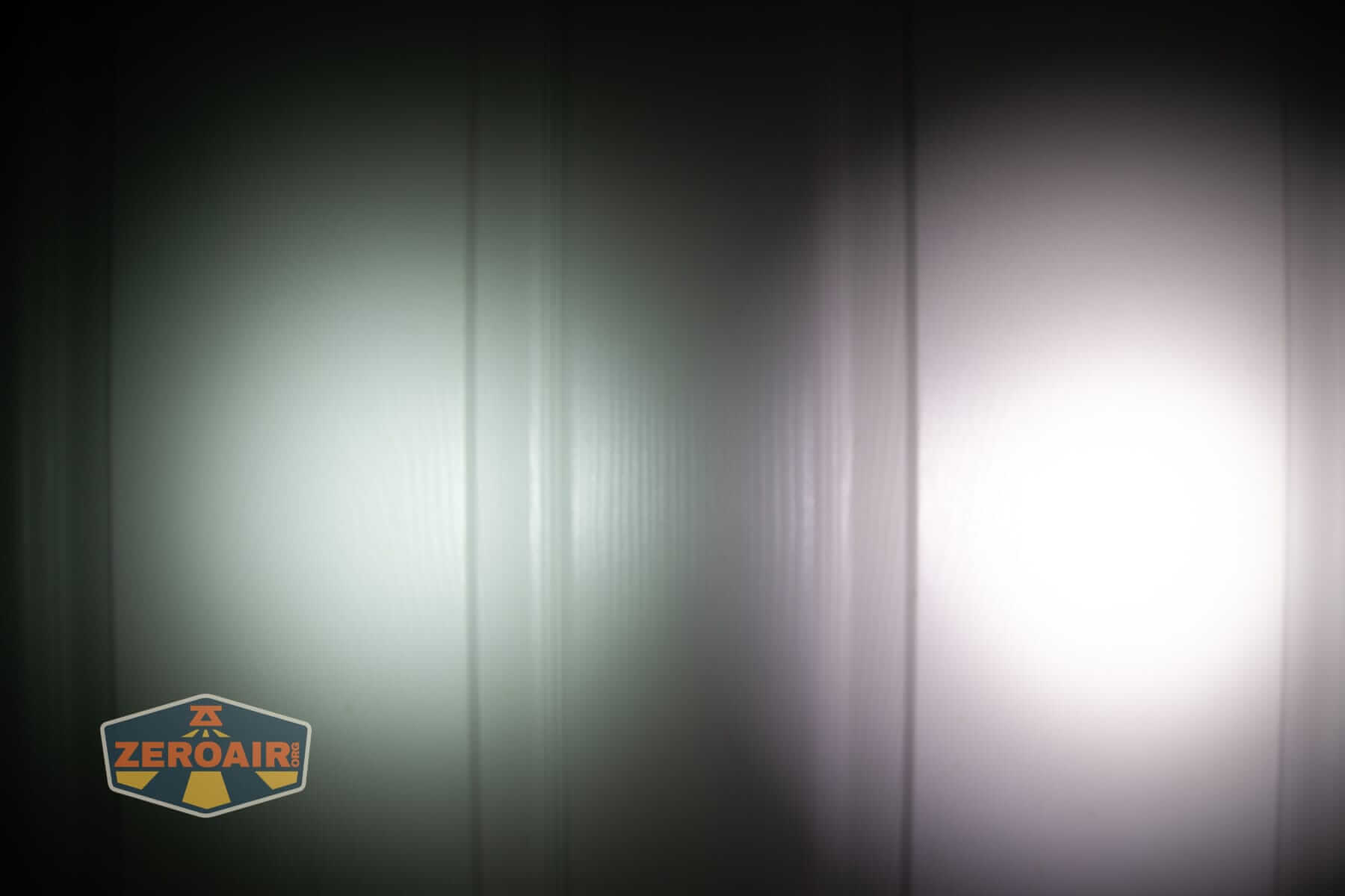 Skilhunt E2A V2 flashlight beamshots on door (at 1') compared to nichia 219b 4500K