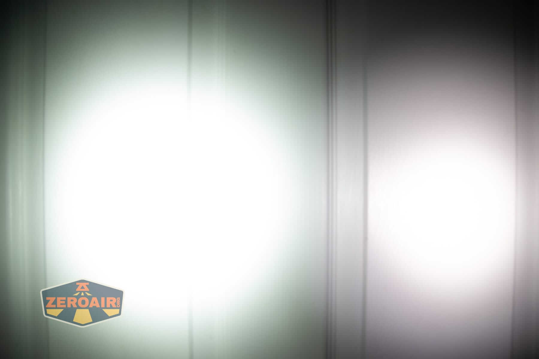 Skilhunt E2A V2 flashlight beamshots on door (at 1') compared to nichia 219b 4500K