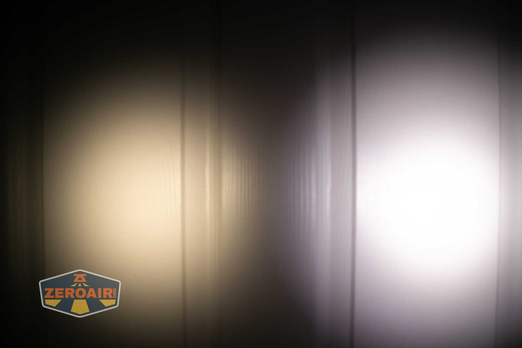 Skilhunt E2A V2 flashlight beamshots on door (at 1') compared to nichia 219b 4500K