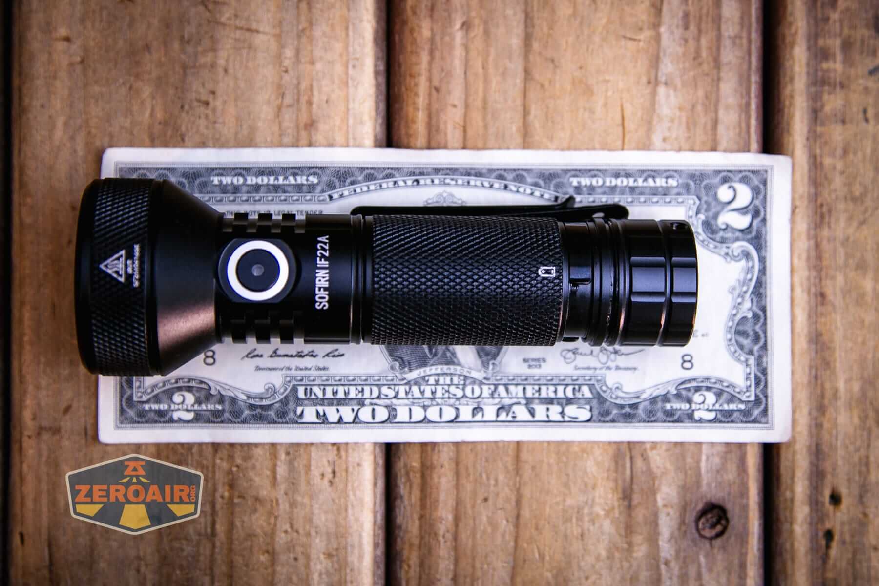 Sofirn IF22A thrower flashlight on a two dollar bill