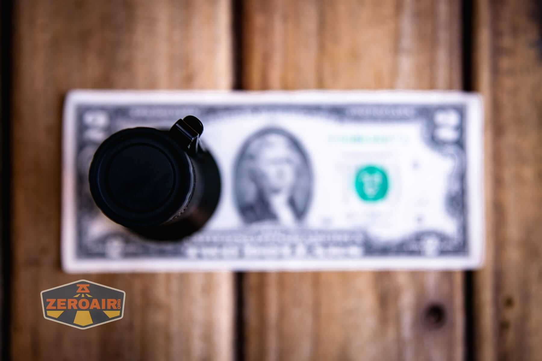 Sofirn IF22A thrower flashlight on a two dollar bill