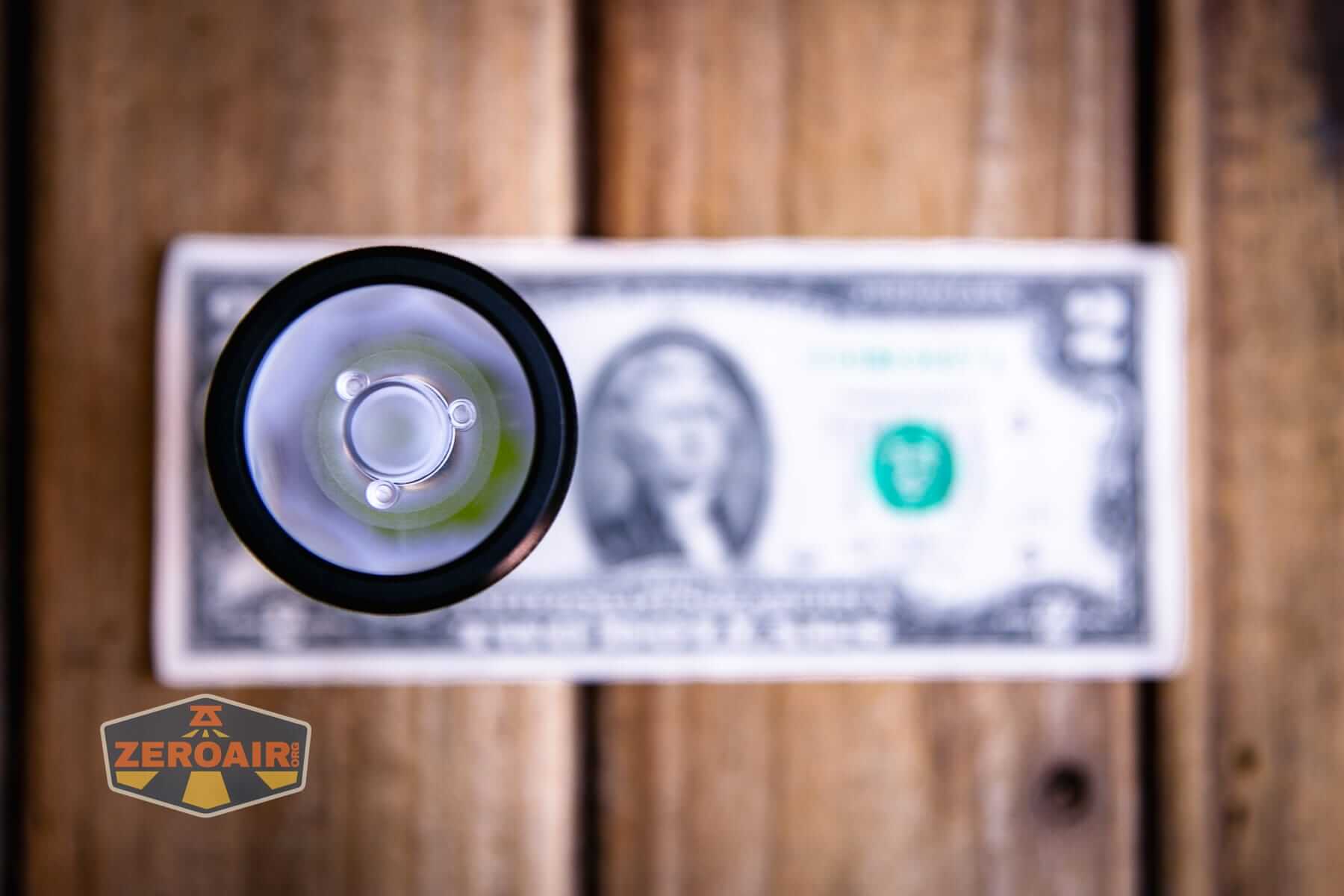 Sofirn IF22A thrower flashlight on a two dollar bill
