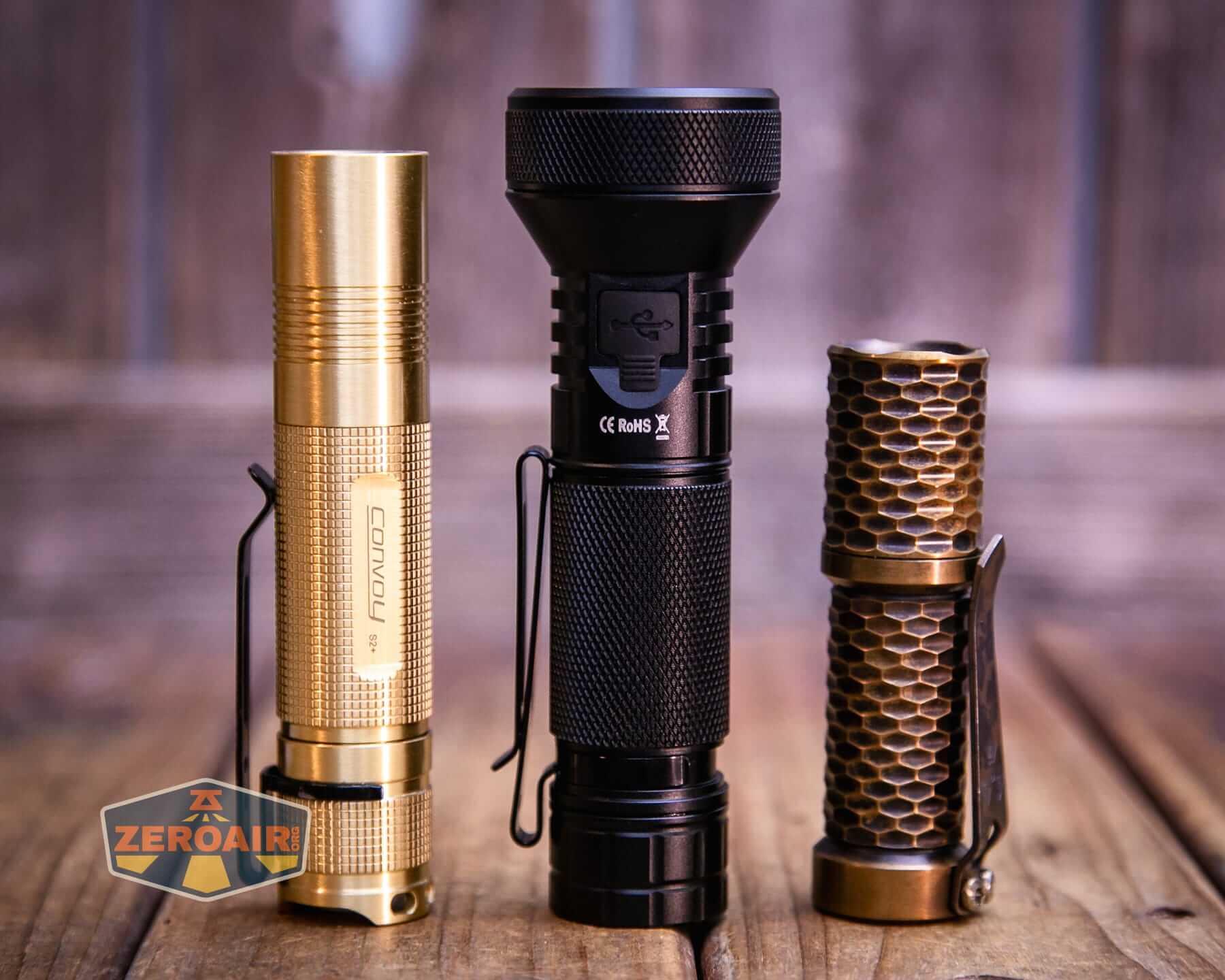 Sofirn IF22A thrower flashlight with two standard sized flashlights