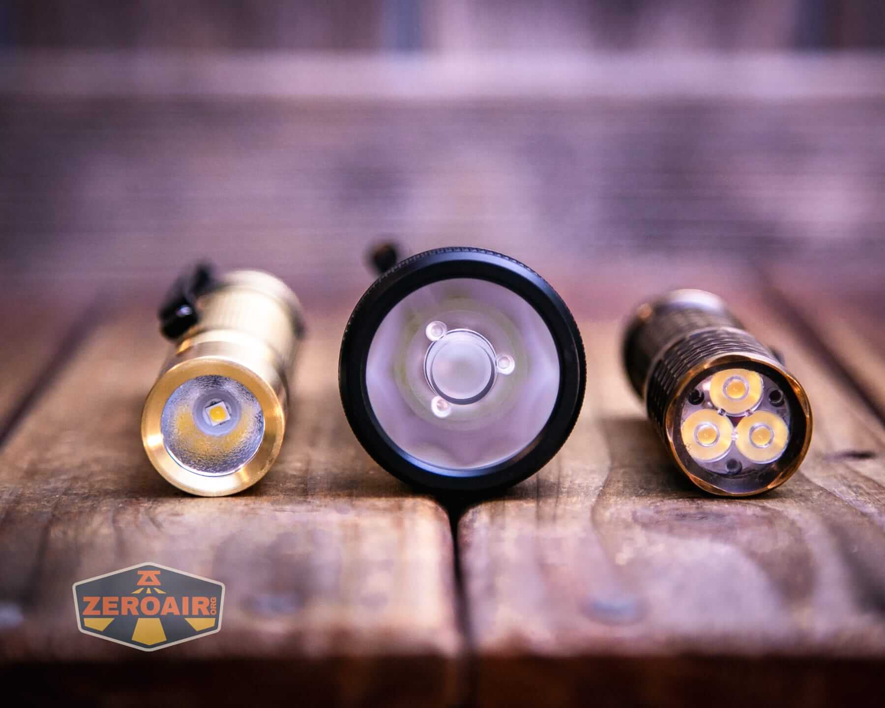 Sofirn IF22A thrower flashlight with two standard sized flashlights