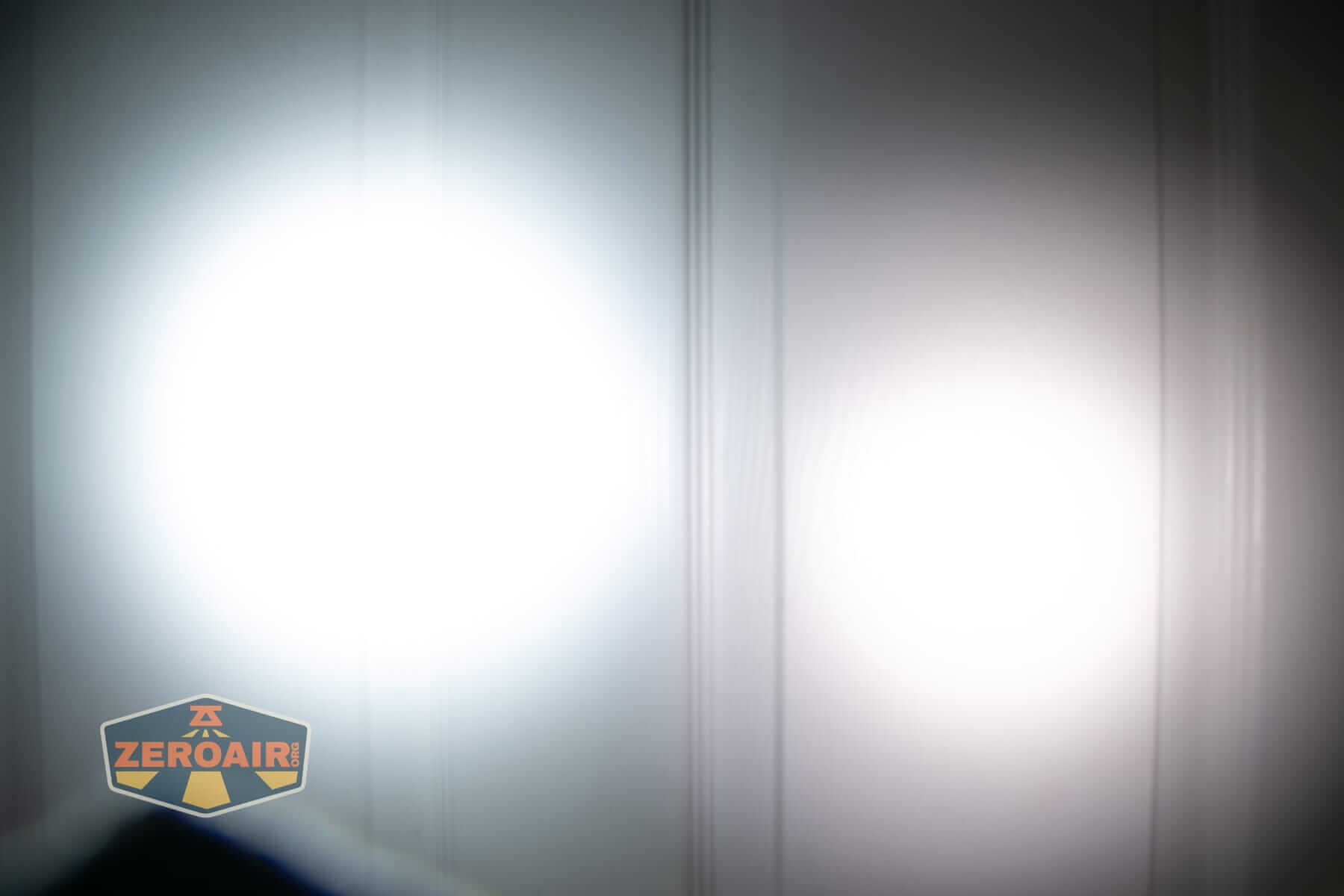 Sofirn IF22A thrower flashlight beamshots on door (at 1') compared to nichia 219b 4500K