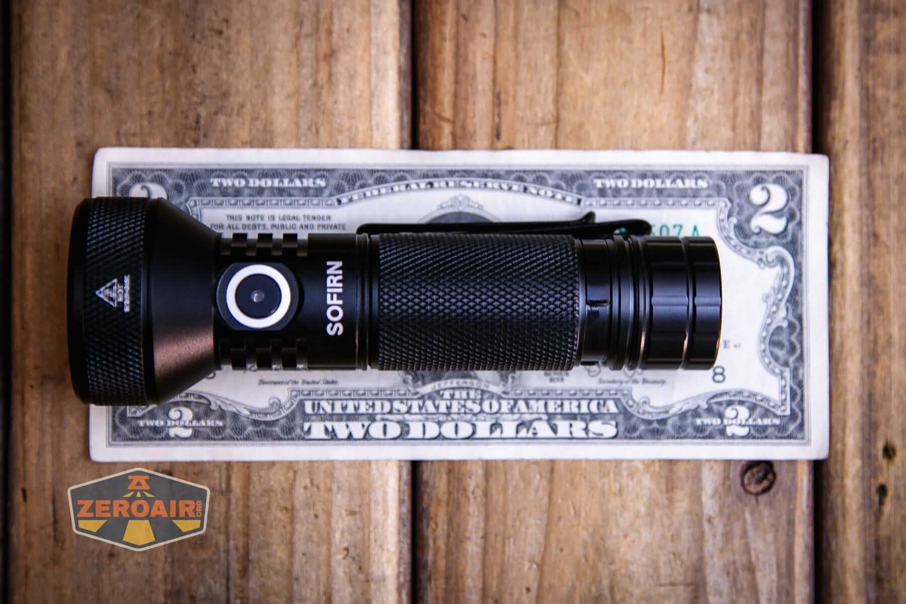 Sofirn IF22A V2 flashlight on a two dollar bill
