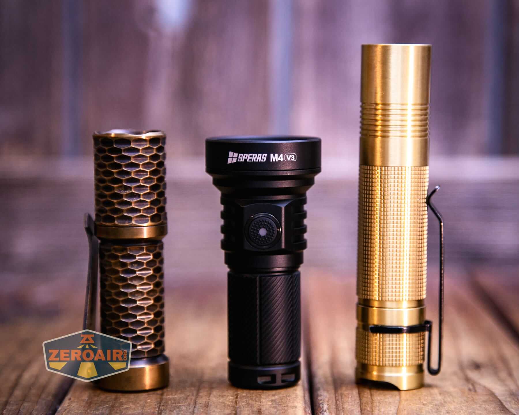 Speras M4 V3 compact EDC flashlight with two standard sized flashlights