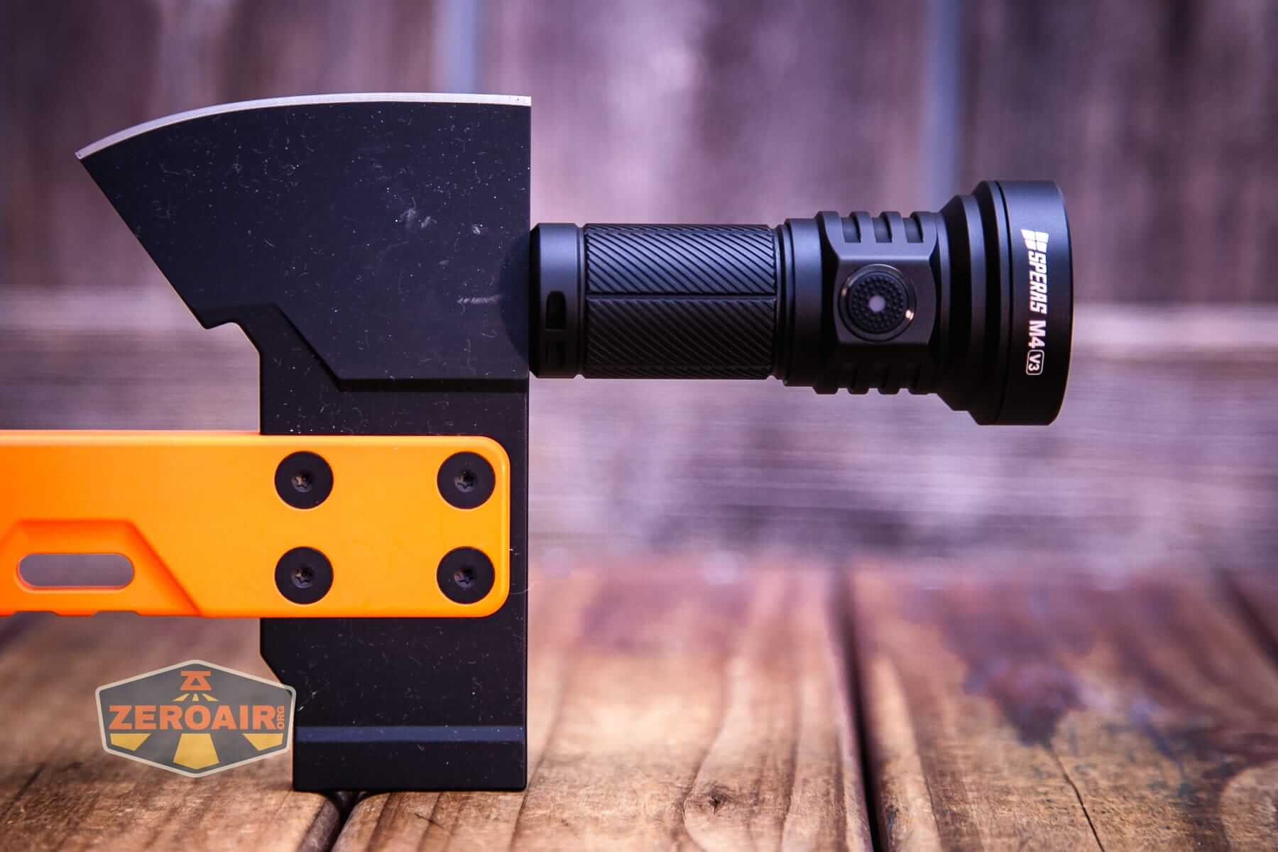 Speras M4 V3 compact EDC flashlight magnet in use