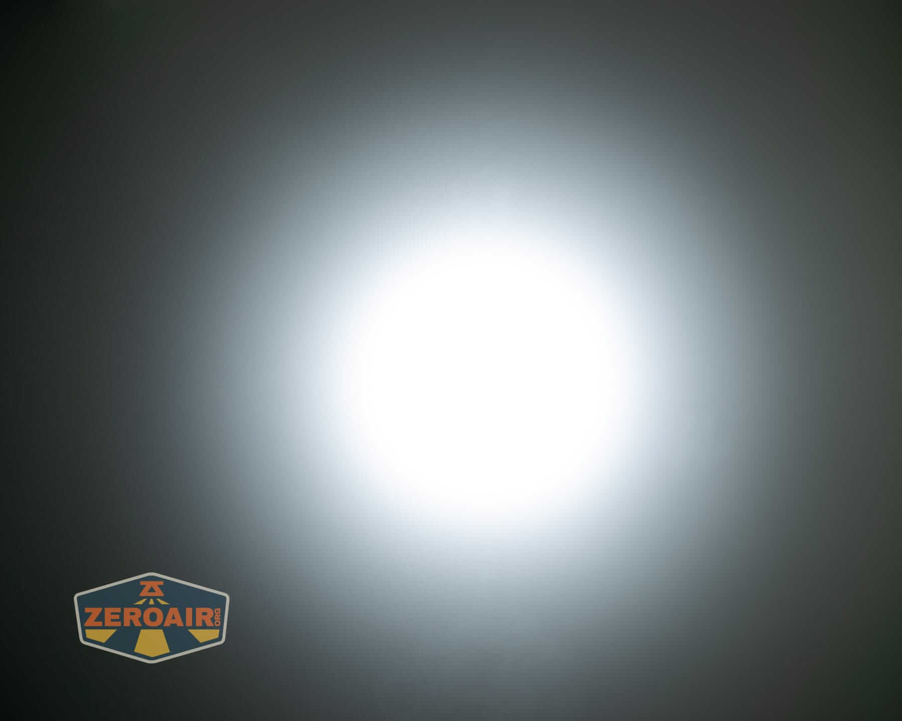 Speras M4 V3 compact EDC flashlight beamshots on ceiling