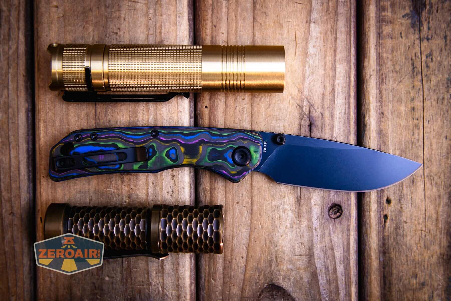 Vosteed Marten 330 knife with two standard-sized flashlights
