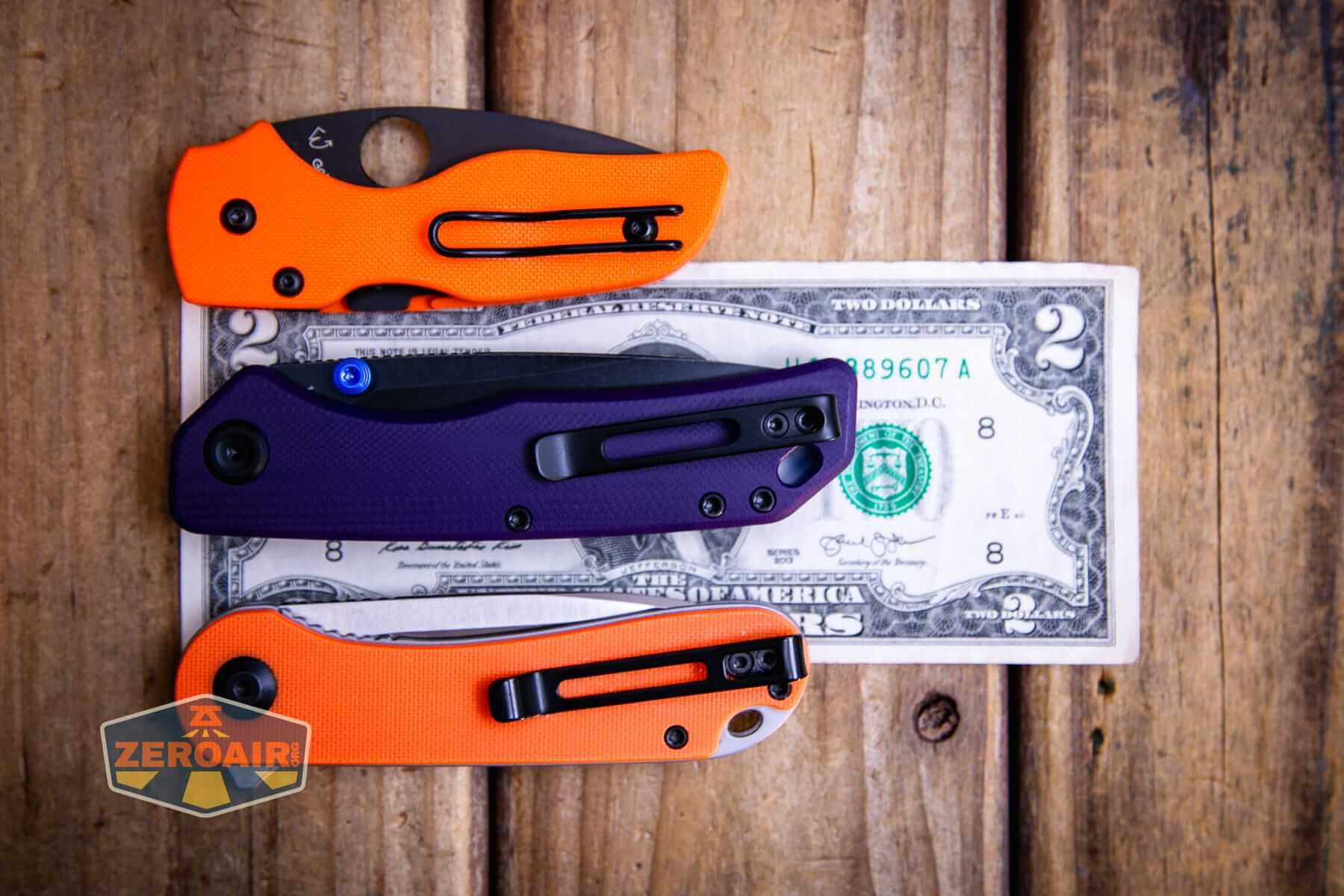 Vosteed Marten 330 Purple knife on two dollar bill and with two standard knives