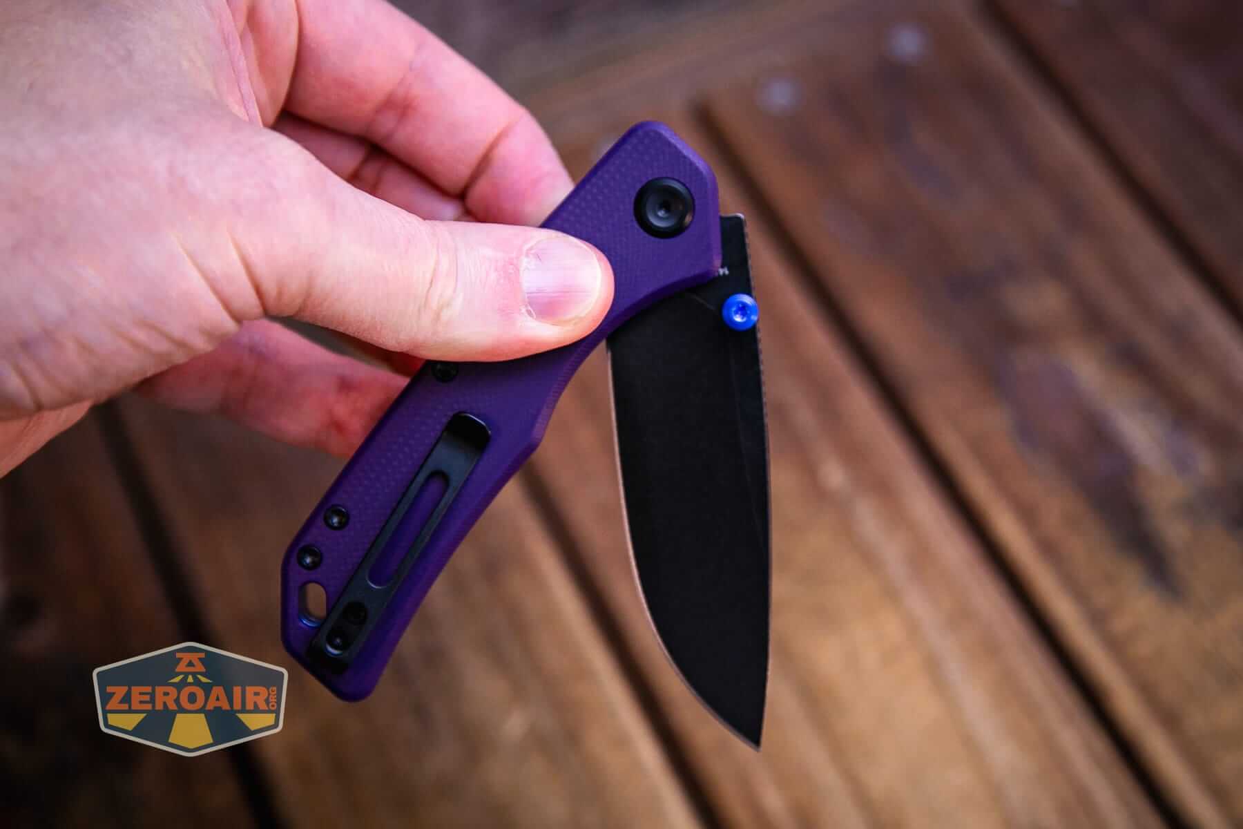 Vosteed Marten 330 Purple knife pressing lock in hand